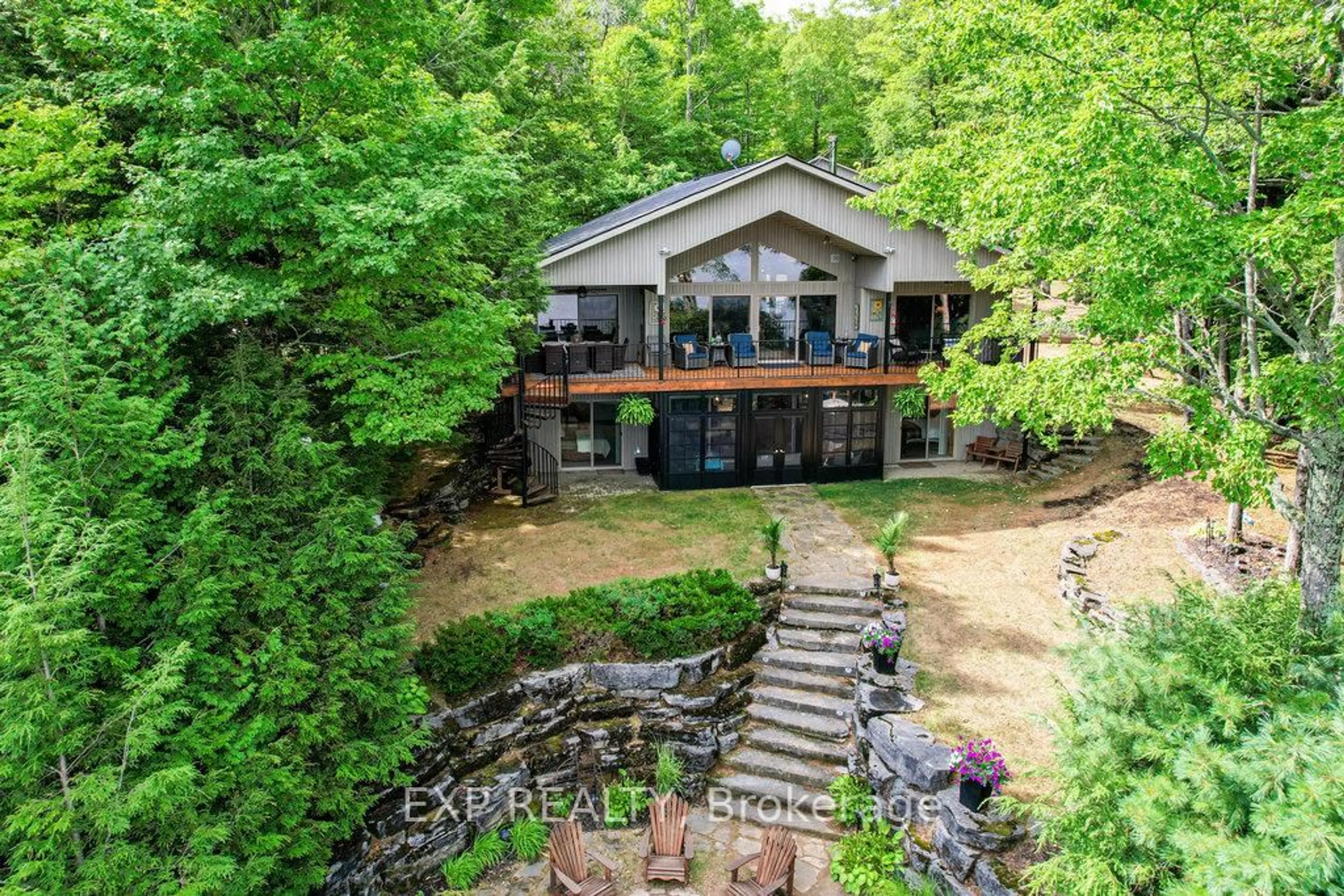 A pic from outside/outdoor area/front of a property/back of a property/a pic from drone, water/lake/river/ocean view for 27 Sylvan Dr, North Kawartha Ontario K0L 1A0