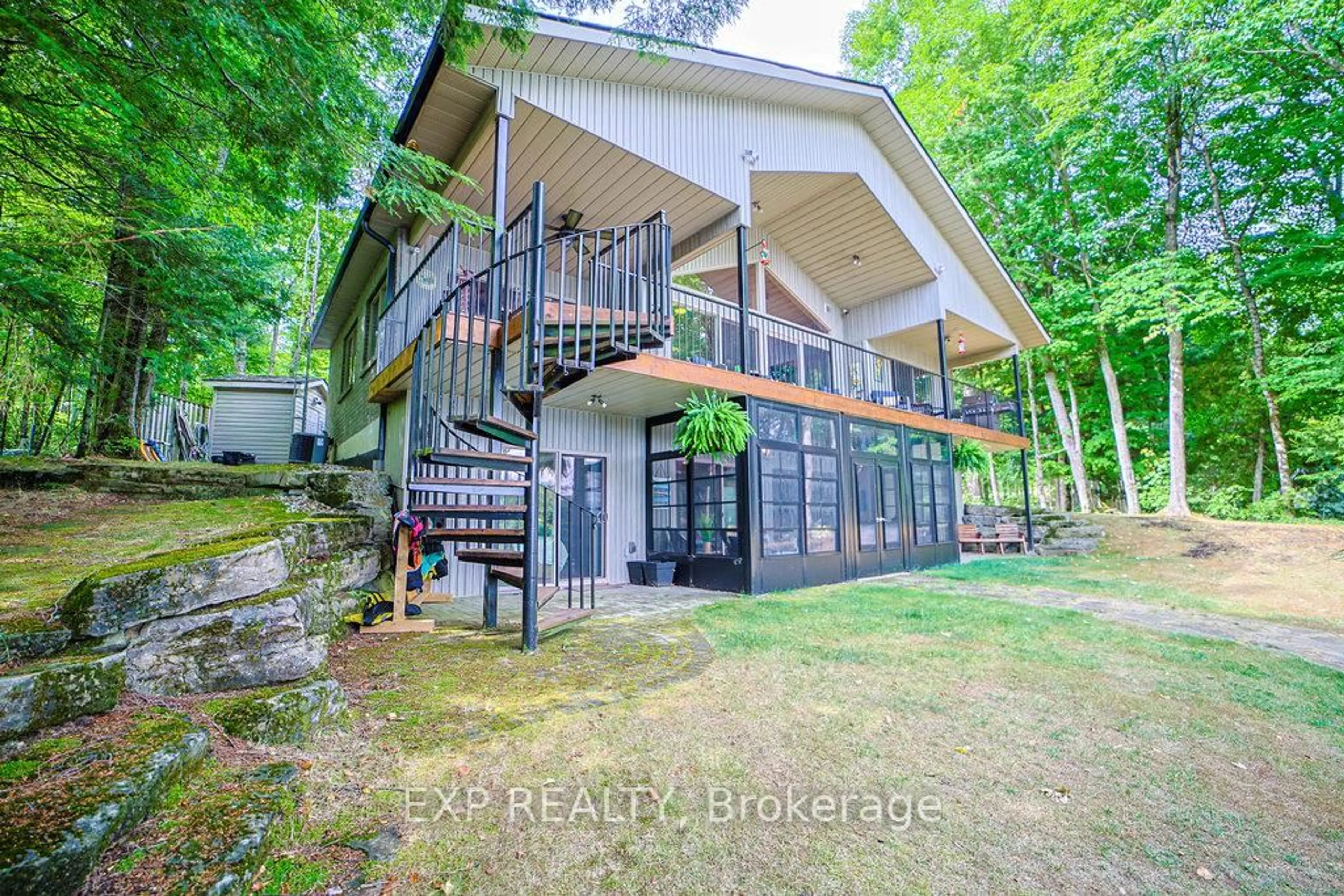 A pic from outside/outdoor area/front of a property/back of a property/a pic from drone, water/lake/river/ocean view for 27 Sylvan Dr, North Kawartha Ontario K0L 1A0