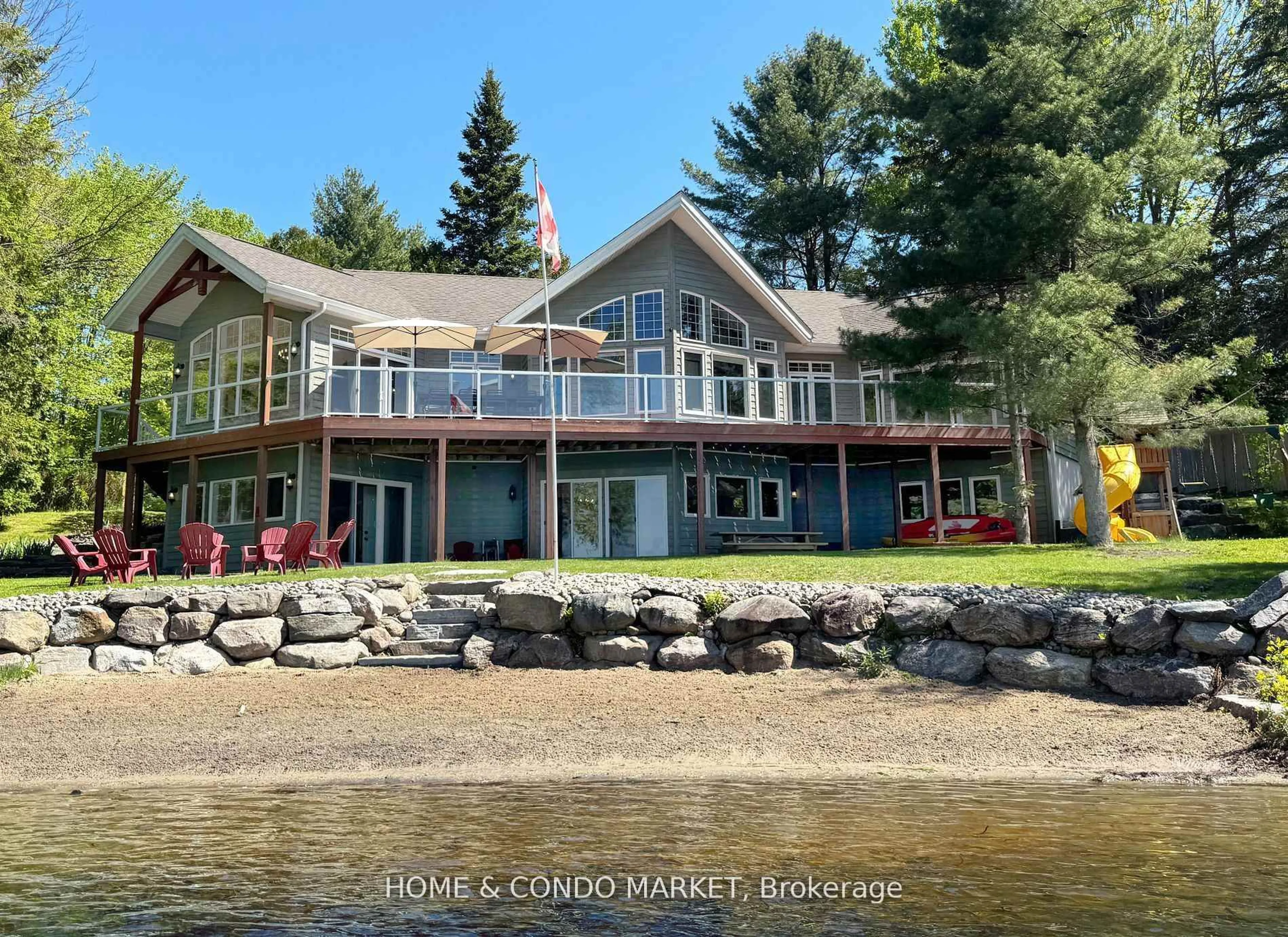 A pic from outside/outdoor area/front of a property/back of a property/a pic from drone, water/lake/river/ocean view for 14 Charles Ave, McKellar Ontario P2A 0B4