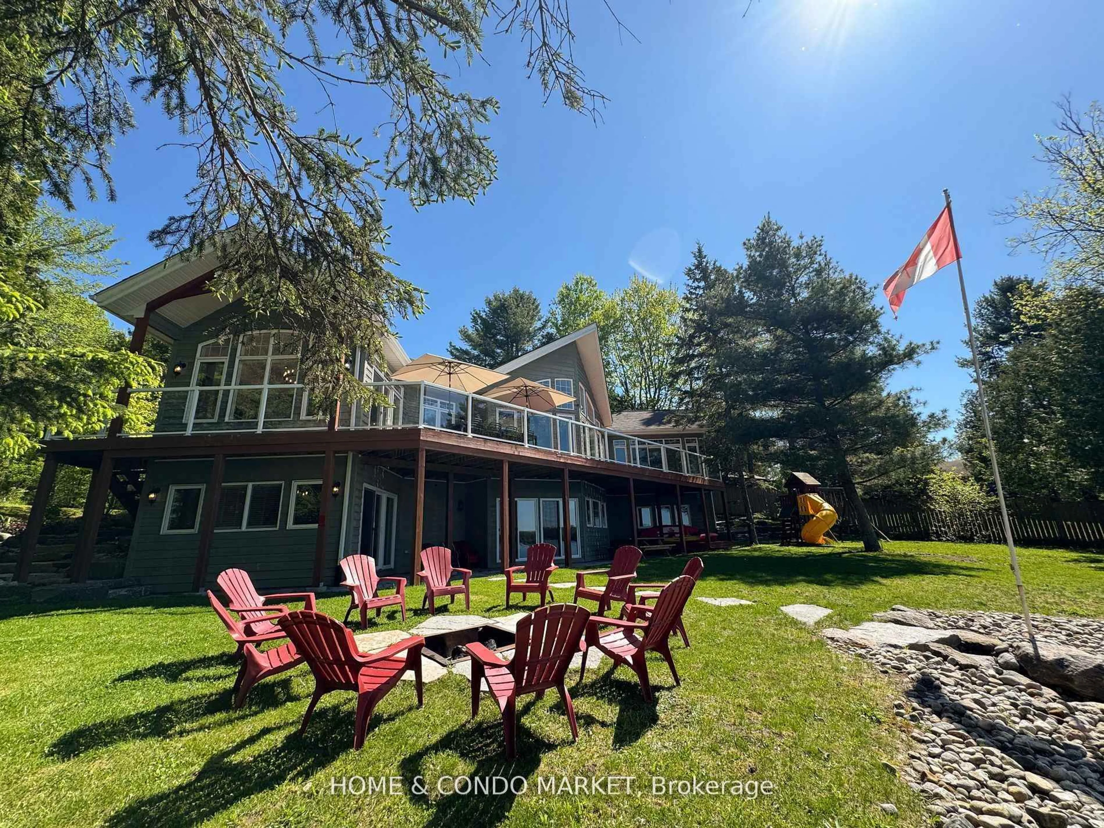 A pic from outside/outdoor area/front of a property/back of a property/a pic from drone, water/lake/river/ocean view for 14 Charles Ave, McKellar Ontario P2A 0B4