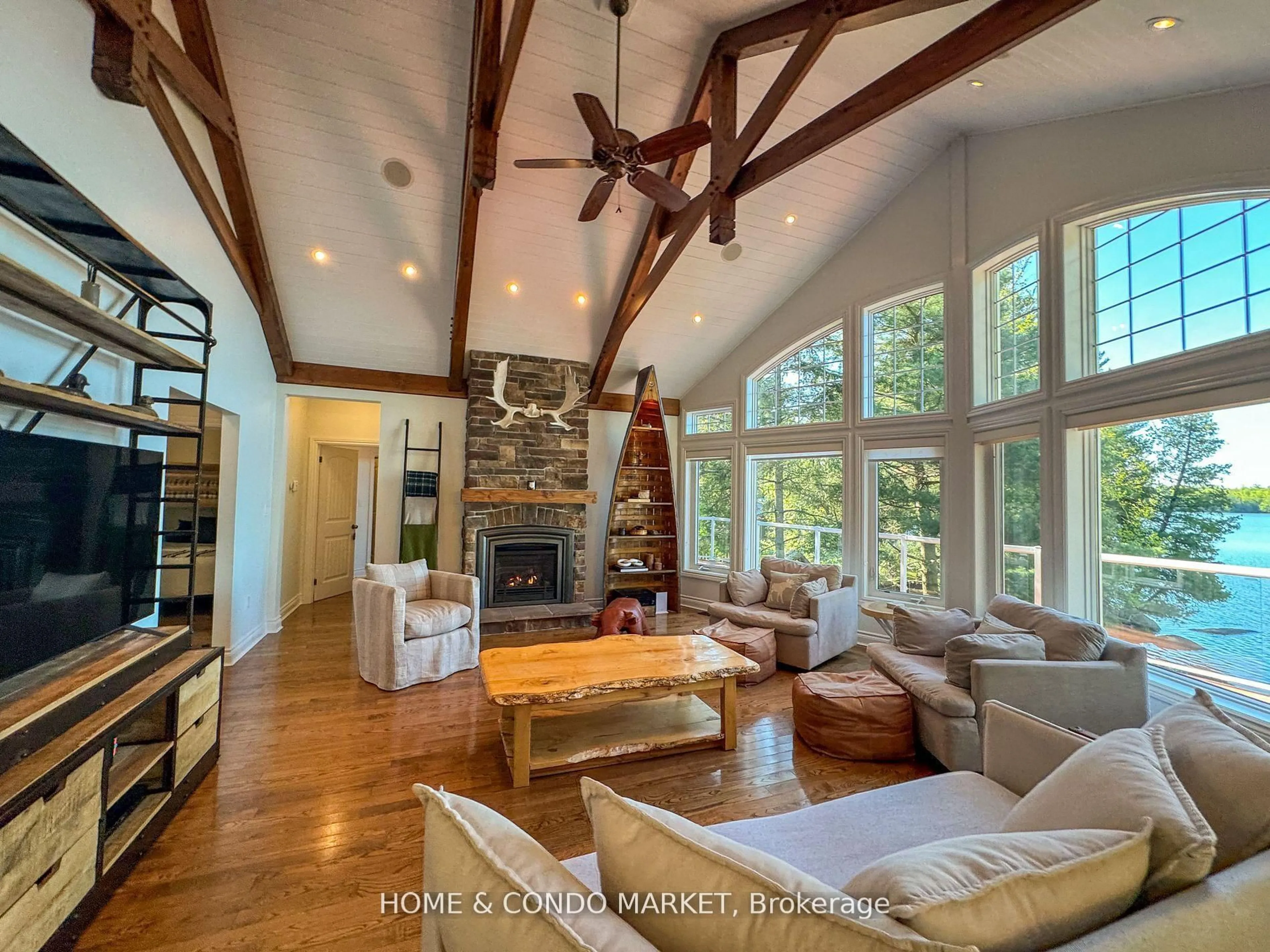 Living room with furniture, wood/laminate floor for 14 Charles Ave, McKellar Ontario P2A 0B4