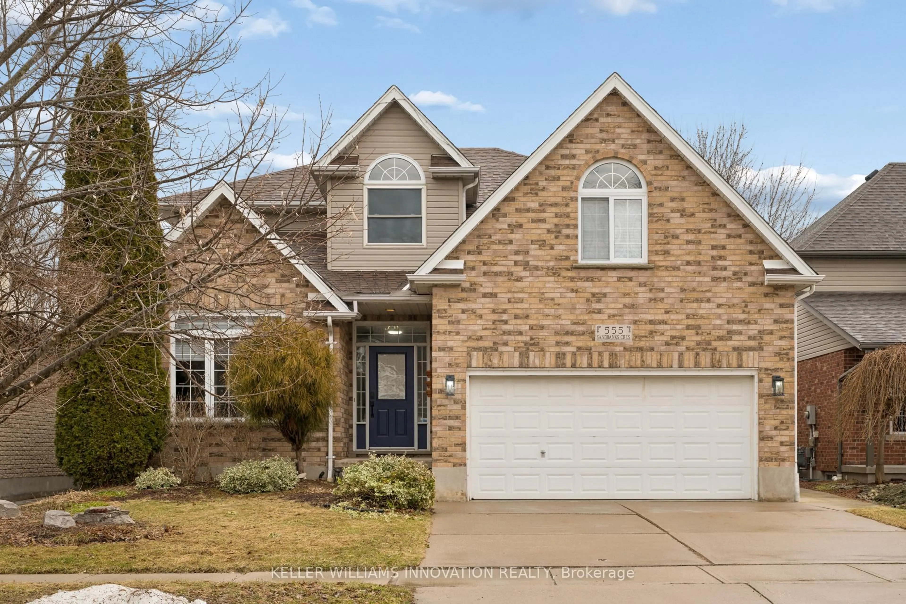 Home with brick exterior material, street for 555 Sandbanks Cres, Waterloo Ontario N2V 2K2