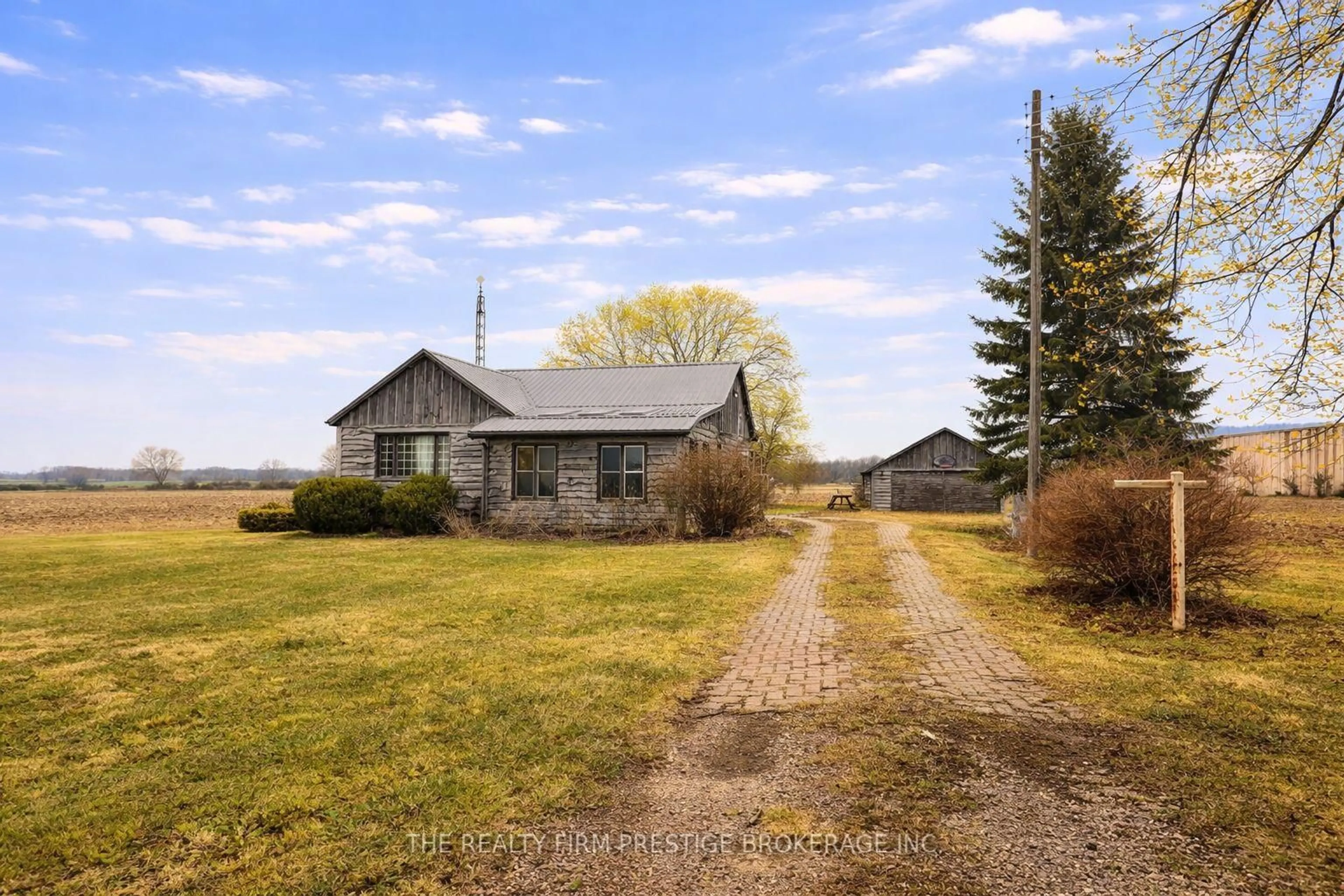 A pic from outside/outdoor area/front of a property/back of a property/a pic from drone, street for 23104 Johnston Line, West Elgin Ontario N0L 2C0