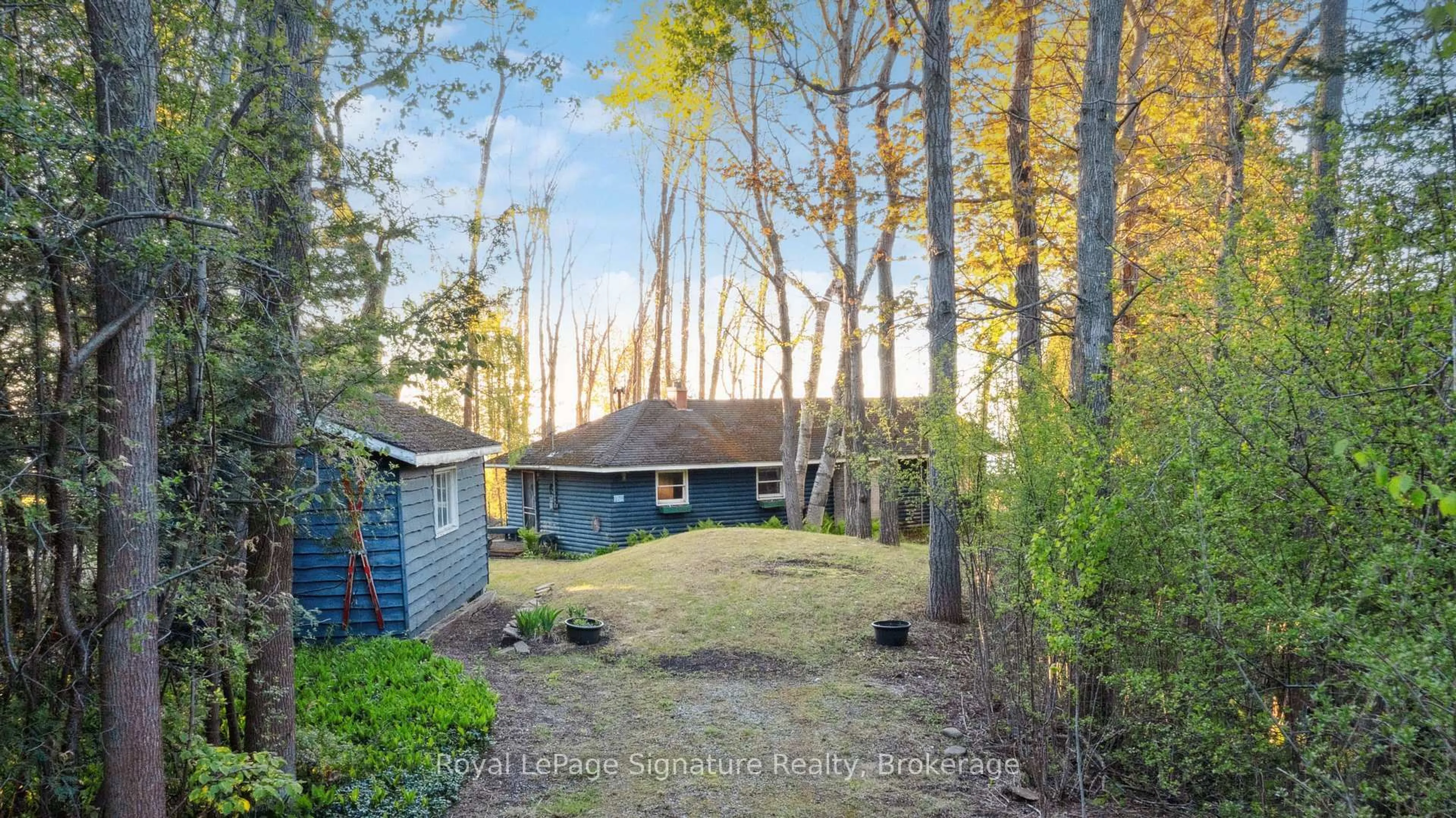A pic from outside/outdoor area/front of a property/back of a property/a pic from drone, forest/trees view for 129 Sunset Blvd, Blue Mountains Ontario N0H 2P0