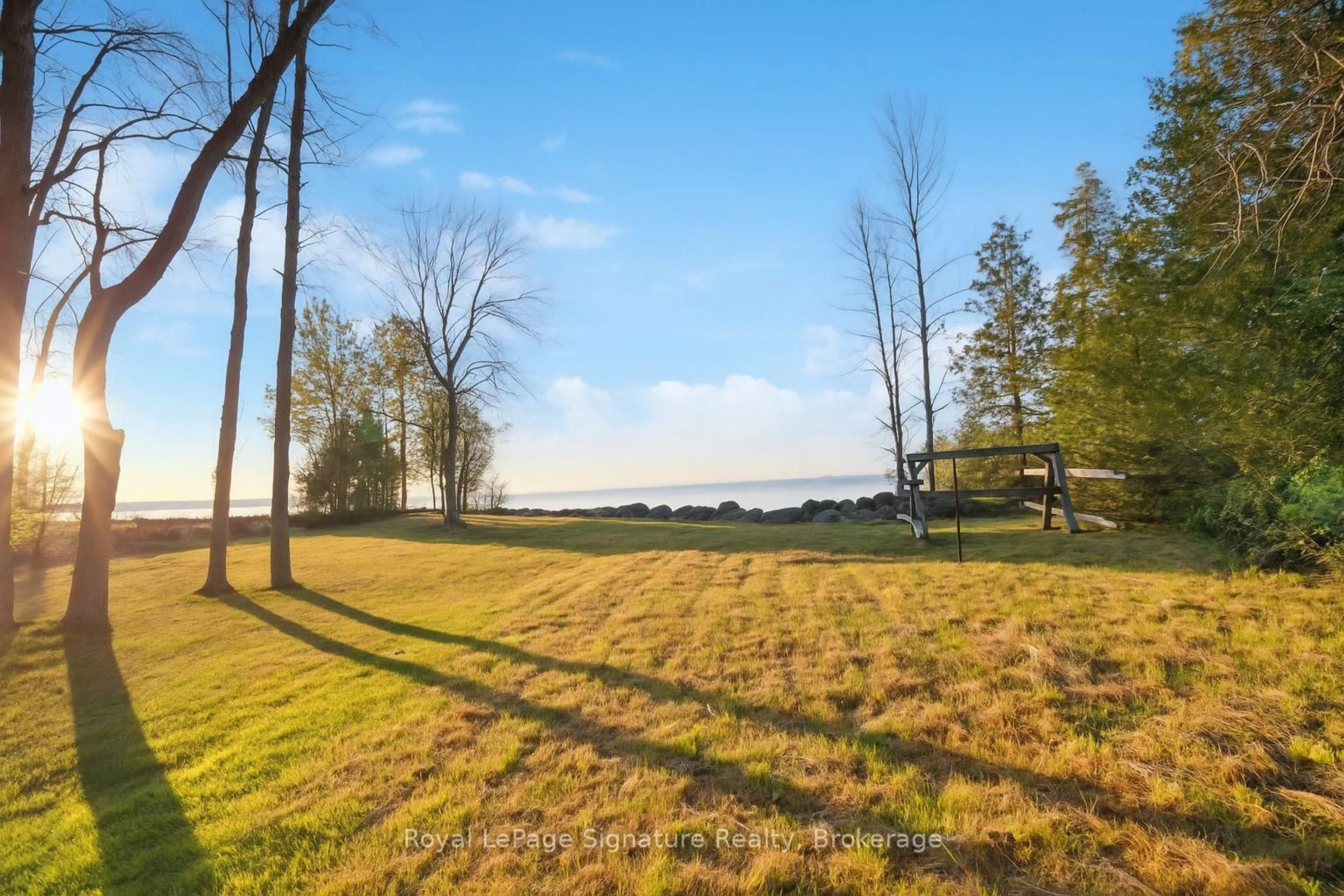 A pic from outside/outdoor area/front of a property/back of a property/a pic from drone, water/lake/river/ocean view for 129 Sunset Blvd, Blue Mountains Ontario N0H 2P0