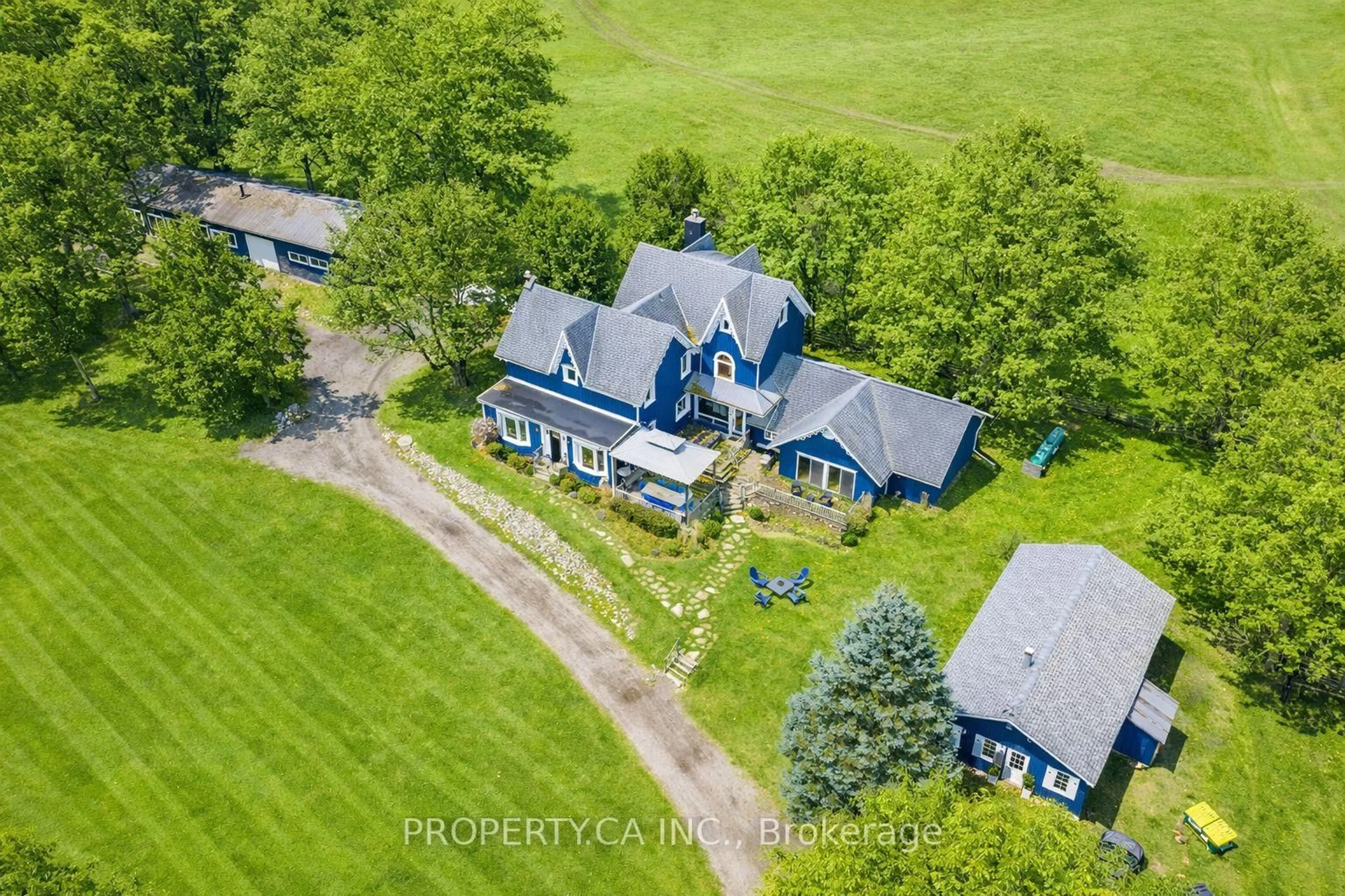 A pic from outside/outdoor area/front of a property/back of a property/a pic from drone, unknown for 876382 5th Line, Mulmur Ontario L9V 0J9