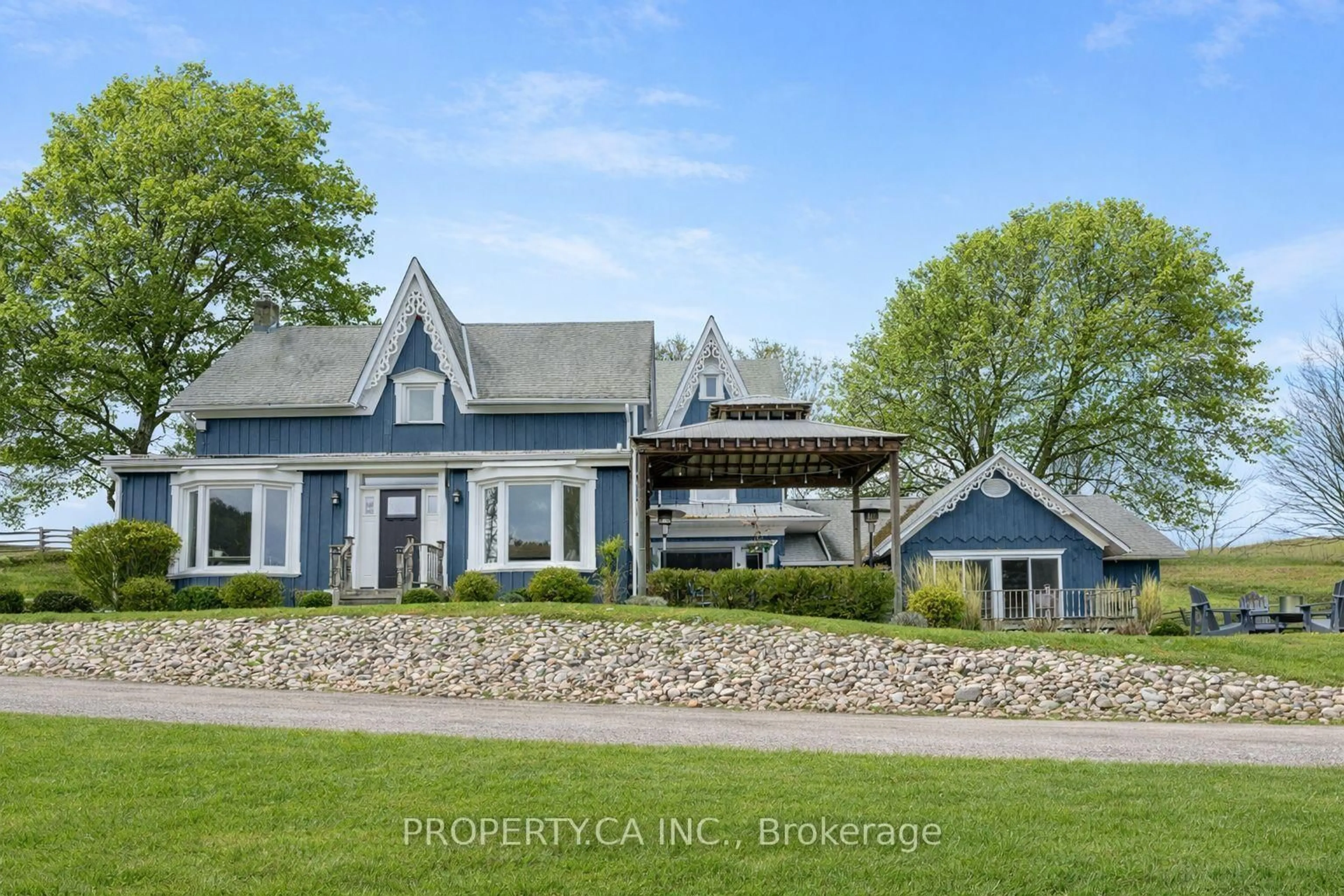 A pic from outside/outdoor area/front of a property/back of a property/a pic from drone, unknown for 876382 5th Line, Mulmur Ontario L9V 0J9