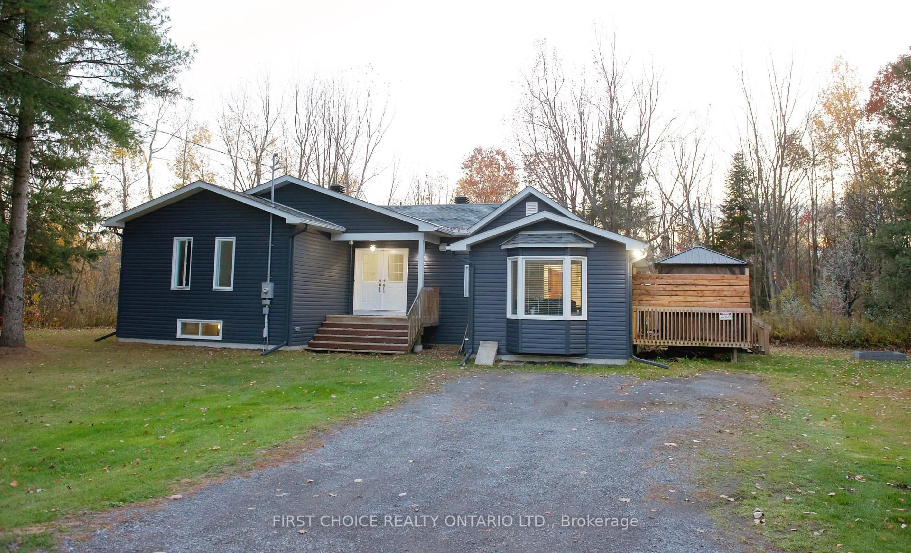 Home with vinyl exterior material, street for 1383 Baker Rd, The Nation Ontario K0A 1M0