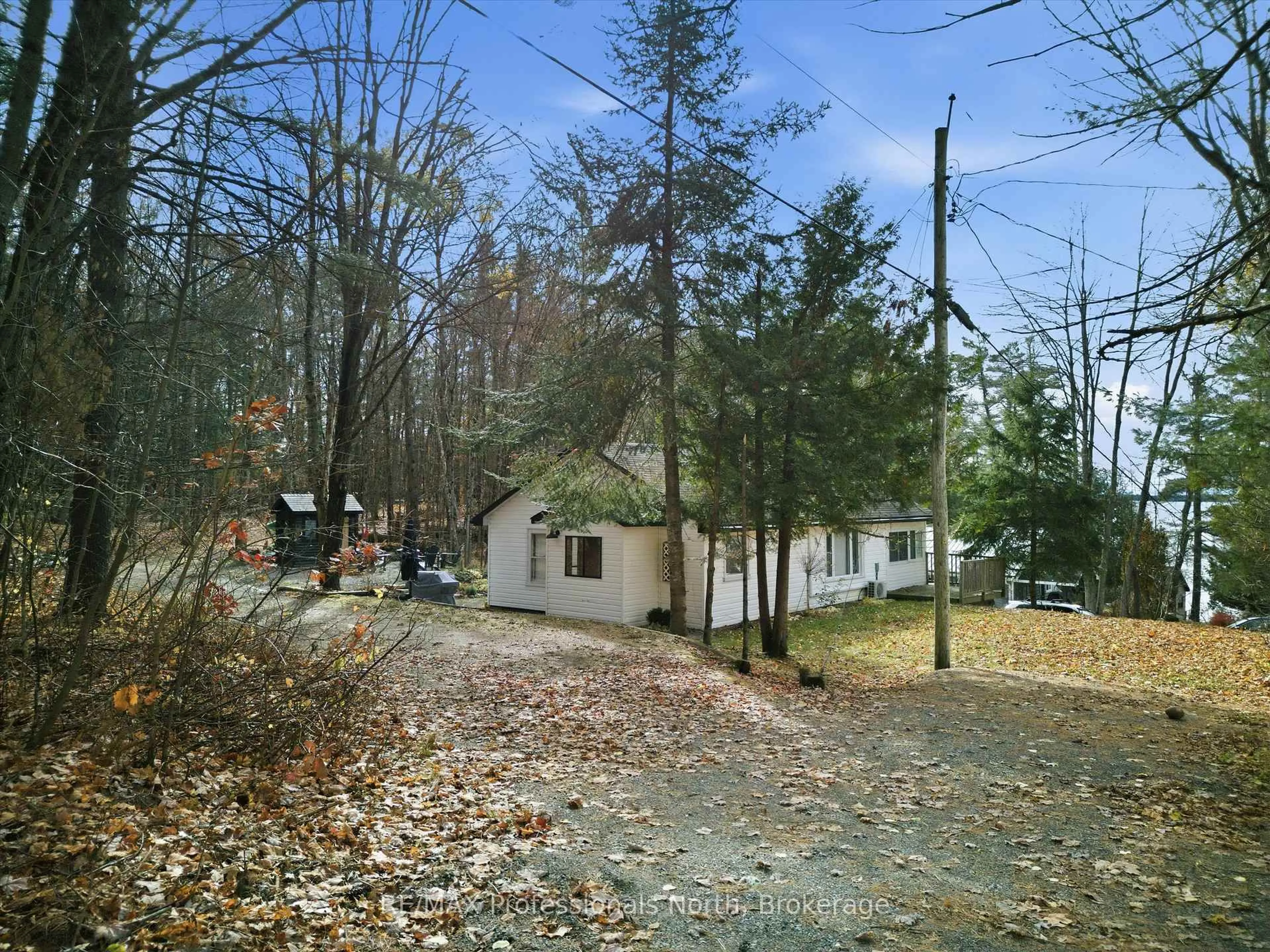 A pic from outside/outdoor area/front of a property/back of a property/a pic from drone, forest/trees view for 1037 STRAWBERRY BAY Rd, Bracebridge Ontario P1L 1X2