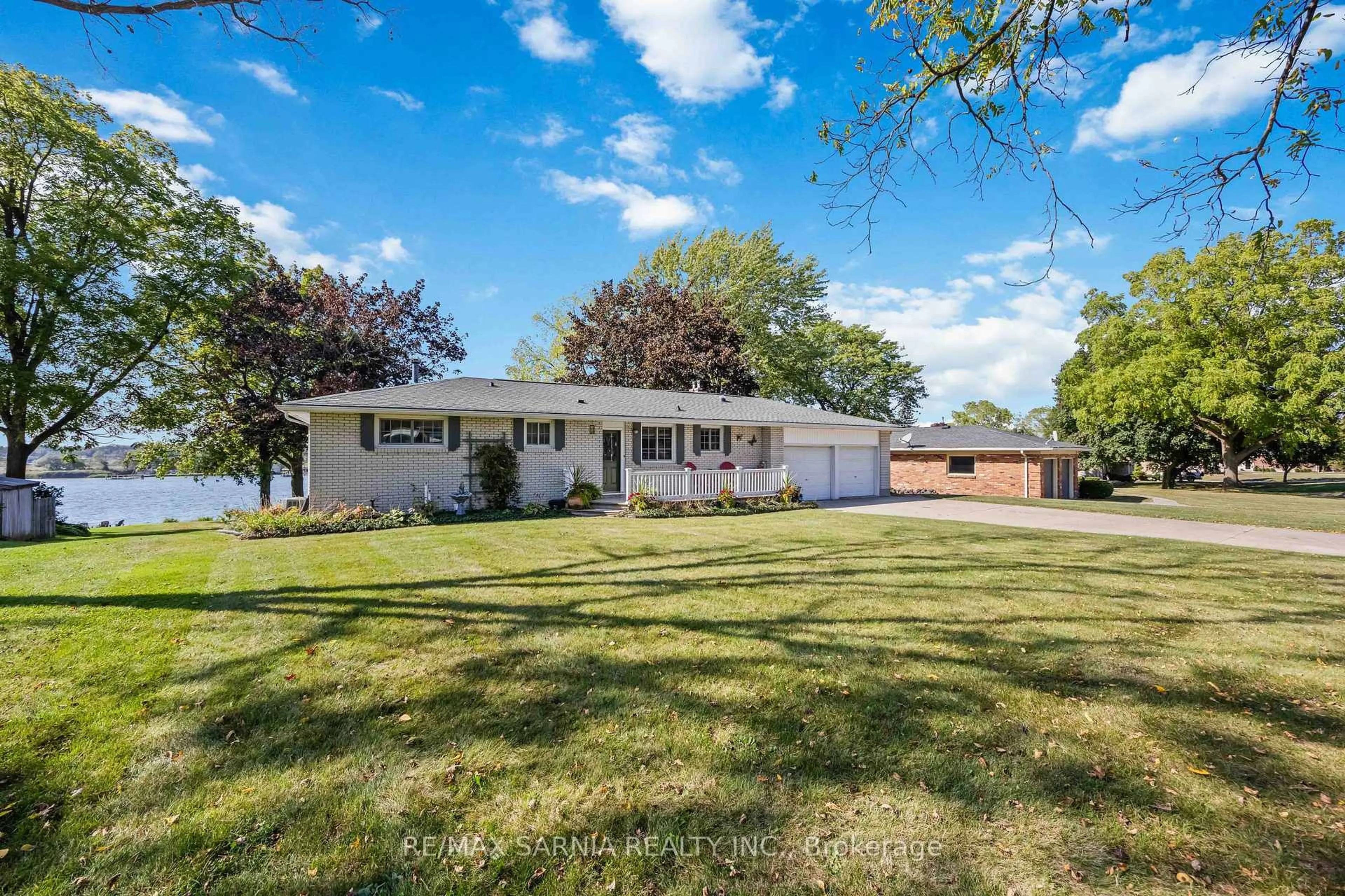 A pic from outside/outdoor area/front of a property/back of a property/a pic from drone, street for 563 Riverside Dr, St. Clair Ontario N0N 1G0