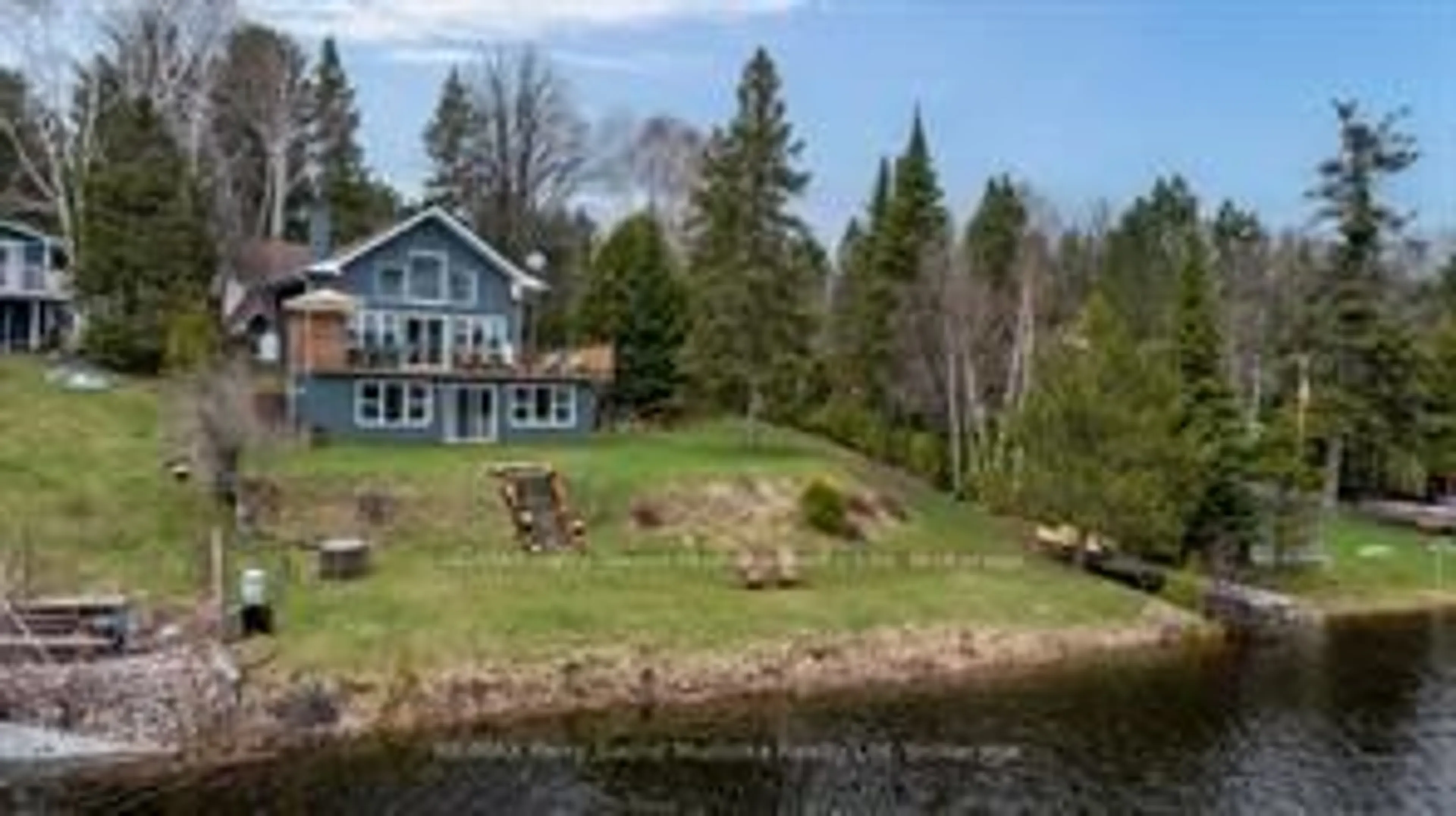 A pic from outside/outdoor area/front of a property/back of a property/a pic from drone, water/lake/river/ocean view for 247 Blue Jay Rd, French River Ontario P0M 2N0