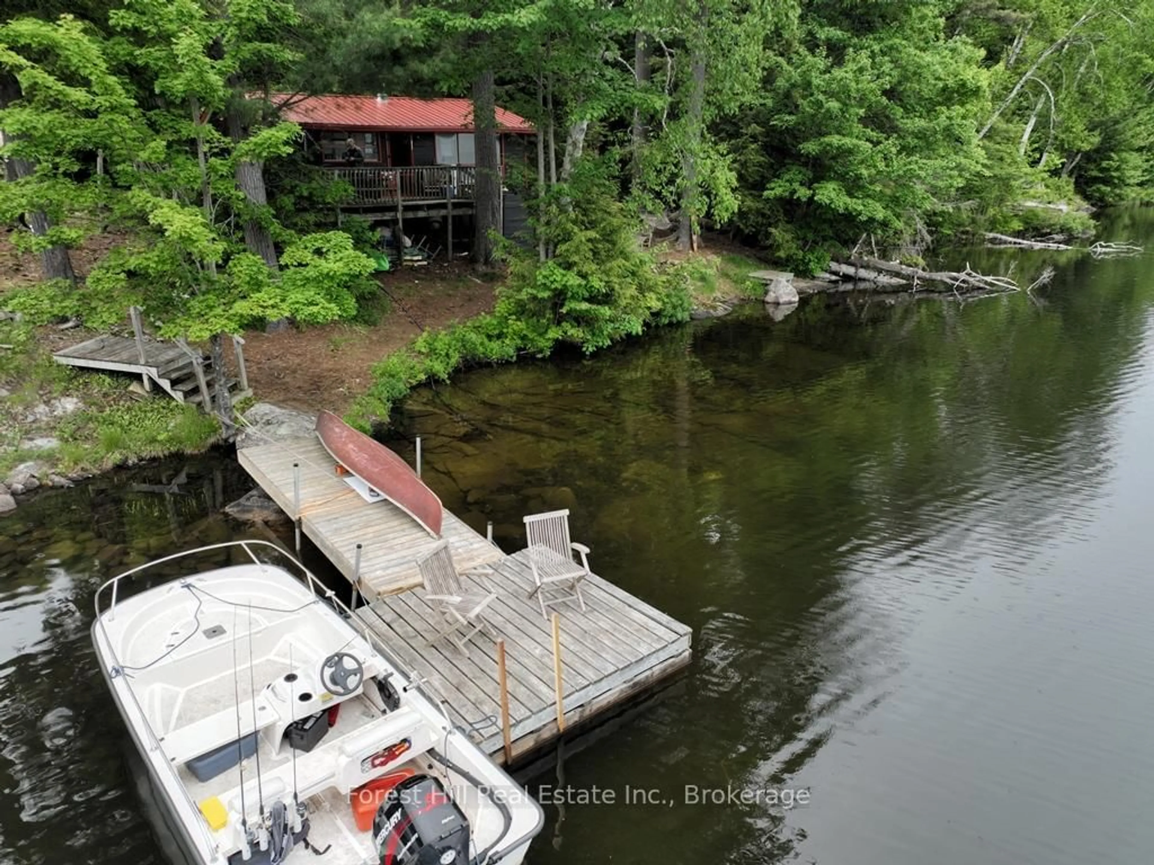 A pic from outside/outdoor area/front of a property/back of a property/a pic from drone, water/lake/river/ocean view for 1293 Causeway Dr, Algonquin Highlands Ontario P0A 1E0