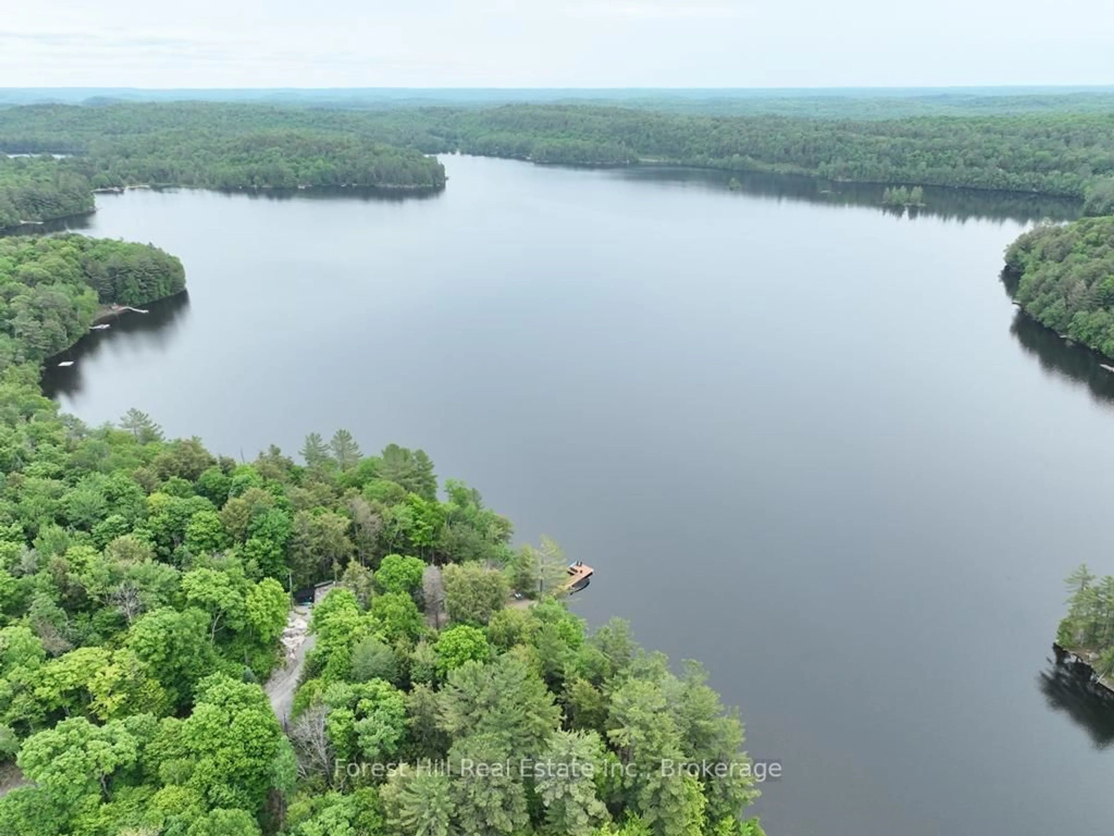 A pic from outside/outdoor area/front of a property/back of a property/a pic from drone, water/lake/river/ocean view for 1293 Causeway Dr, Algonquin Highlands Ontario P0A 1E0