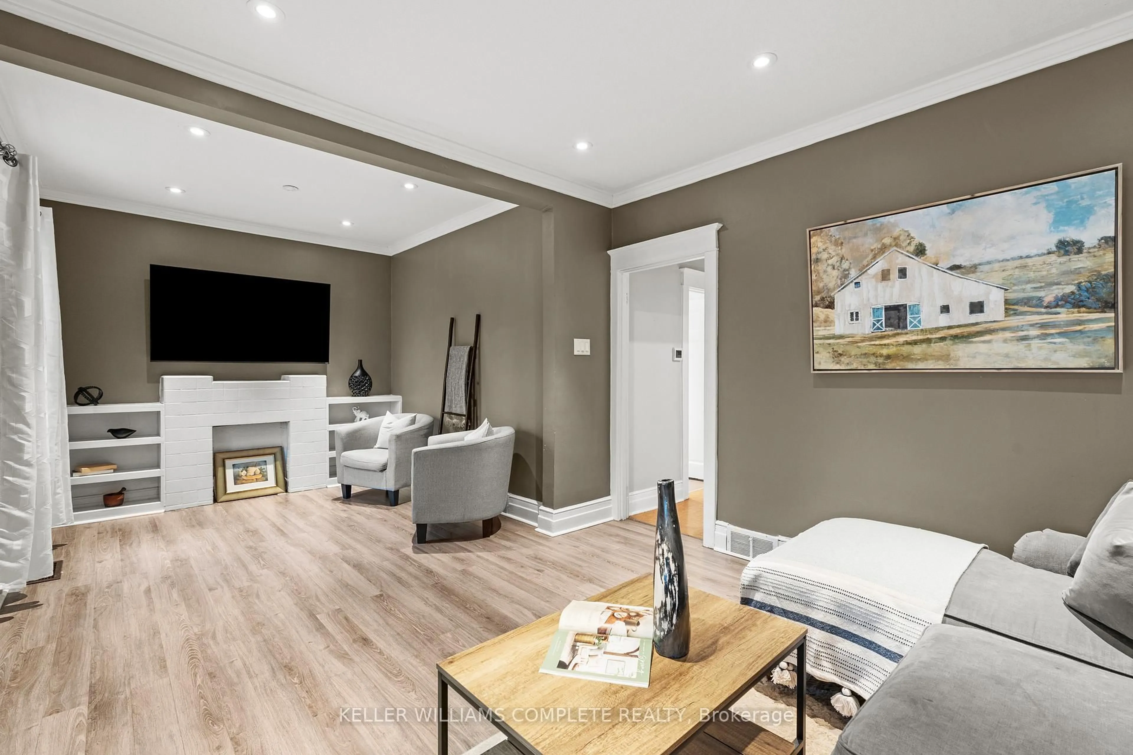 Living room with furniture, wood/laminate floor for 26 Garside Ave, Hamilton Ontario L8H 4W2