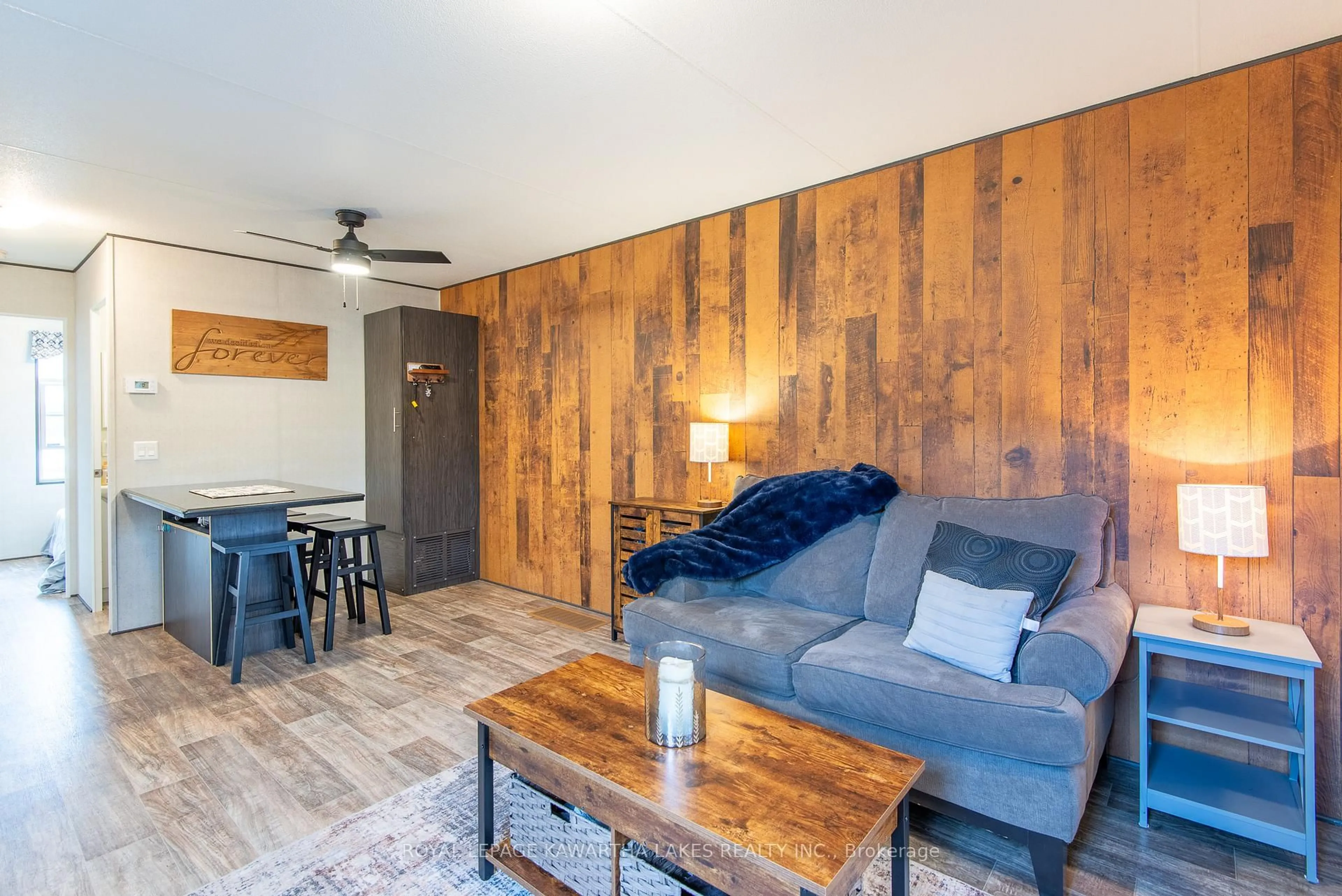 Living room with furniture, wood/laminate floor for 657 Thunder Bridge Rd #W21, Kawartha Lakes Ontario K9V 4R1