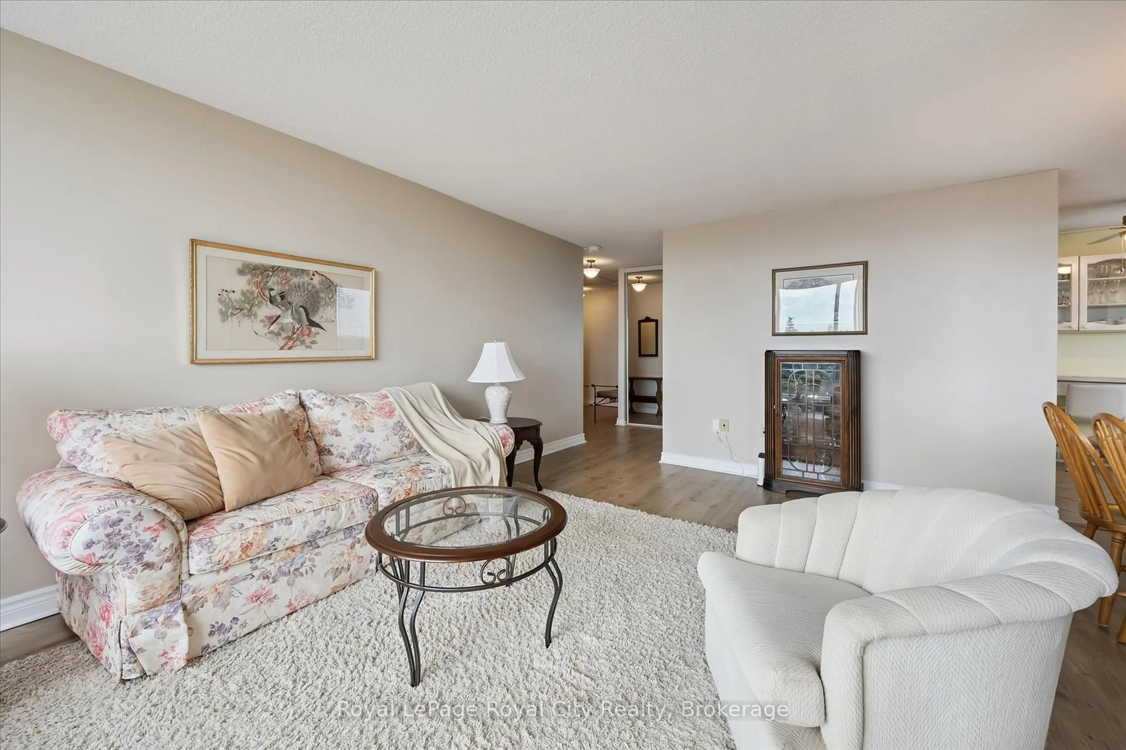 Living room with furniture, carpet floor for 19 Woodlawn Rd #703, Guelph Ontario N1H 7B1