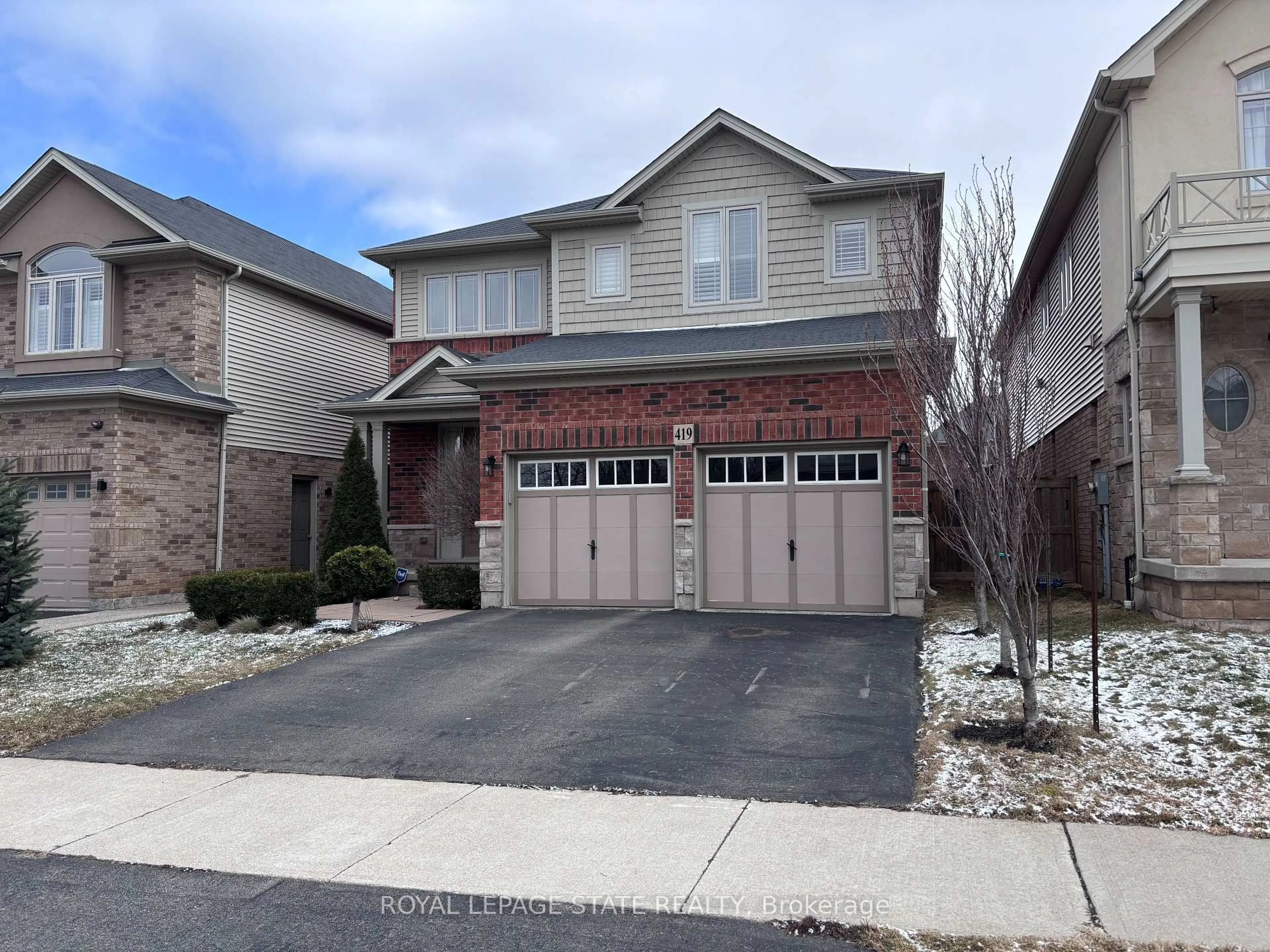 Home with brick exterior material, street for 419 Macintosh Dr, Hamilton Ontario L8E 0H9