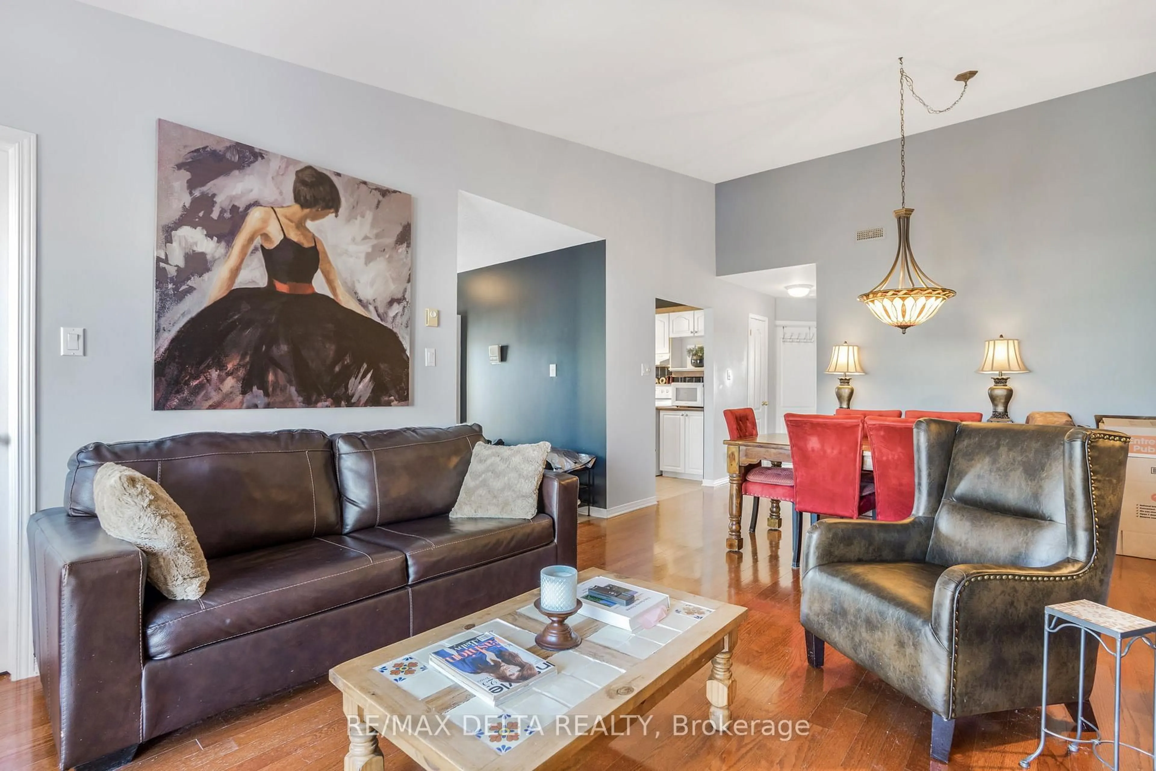 Living room with furniture, wood/laminate floor for 2927 Laurier St #208, Clarence-Rockland Ontario K4K 1T8