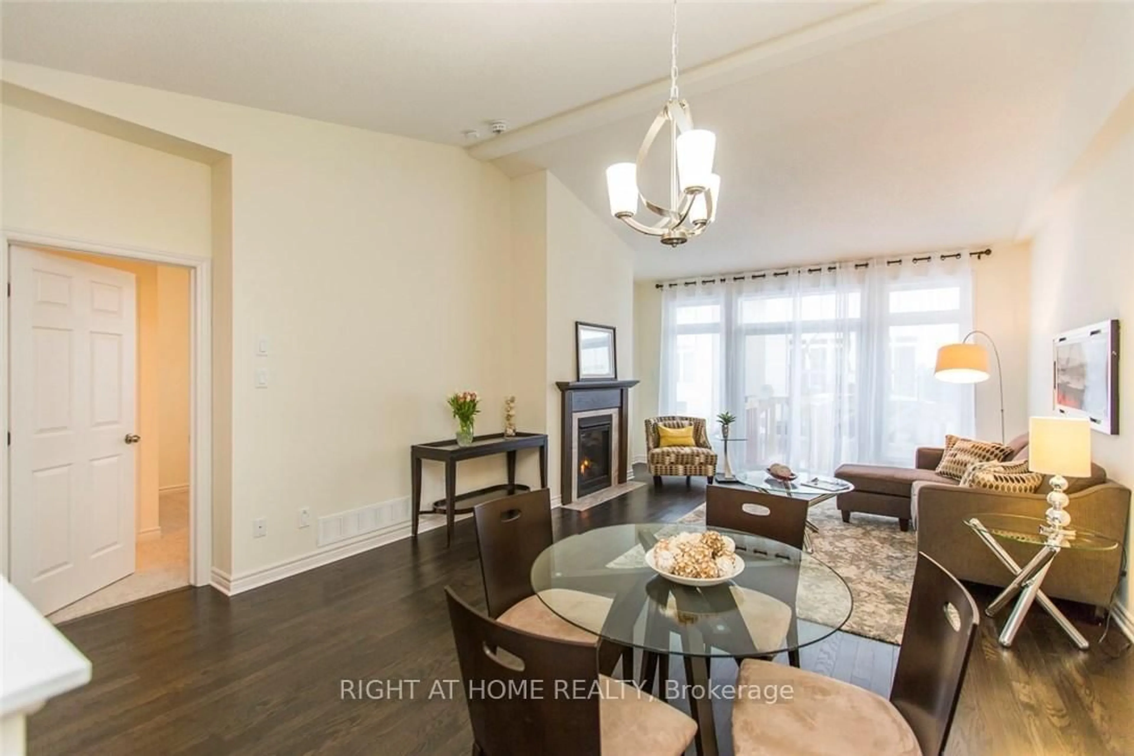 Living room with furniture, wood/laminate floor for 113 PASSAGEWAY Way, Kanata Ontario K2M 1H6