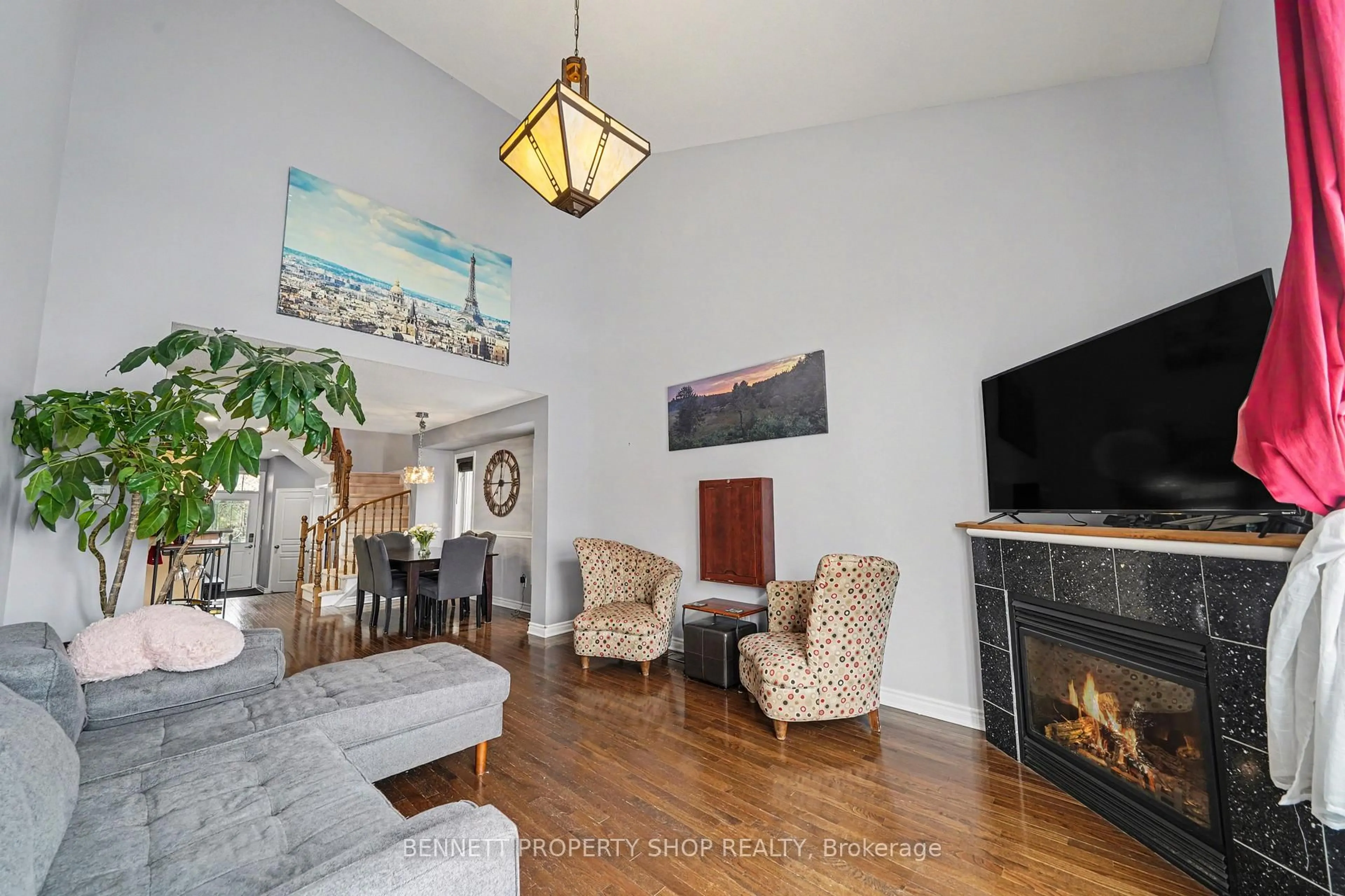 Living room with furniture, wood/laminate floor for 366 Grey Seal Circ, Ottawa Ontario K1V 2H5