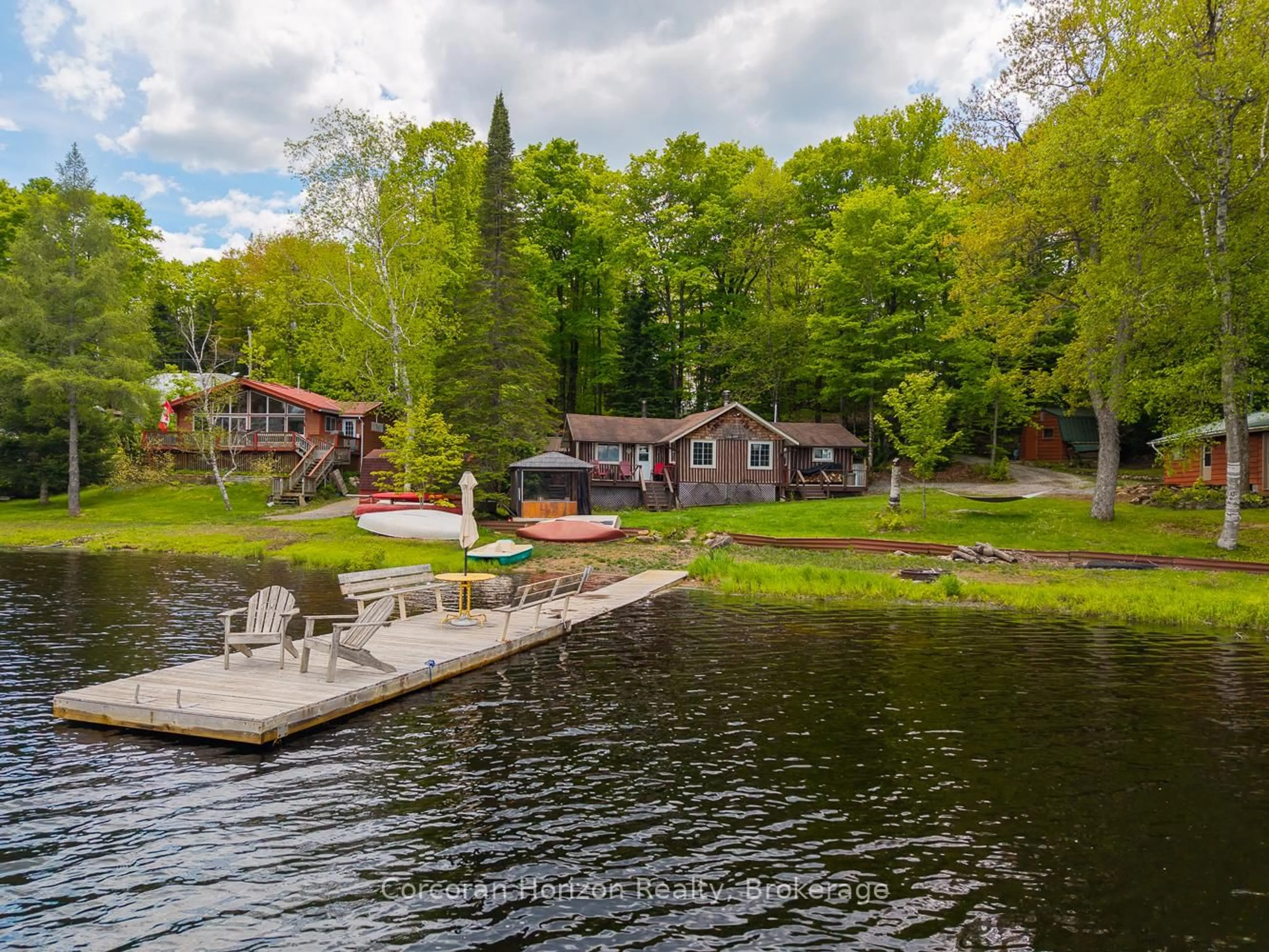 A pic from outside/outdoor area/front of a property/back of a property/a pic from drone, water/lake/river/ocean view for 247 Mainhood Rd, Huntsville Ontario P0B 1M0