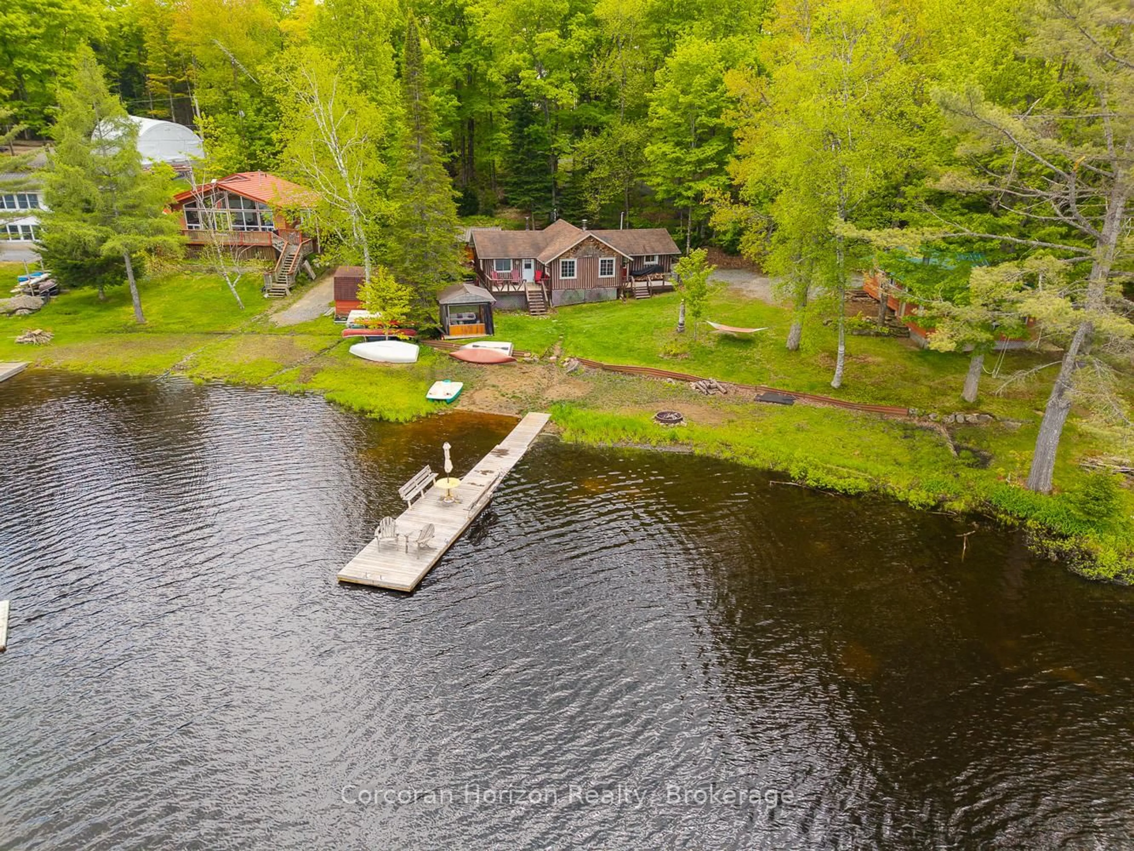 A pic from outside/outdoor area/front of a property/back of a property/a pic from drone, water/lake/river/ocean view for 247 Mainhood Rd, Huntsville Ontario P0B 1M0