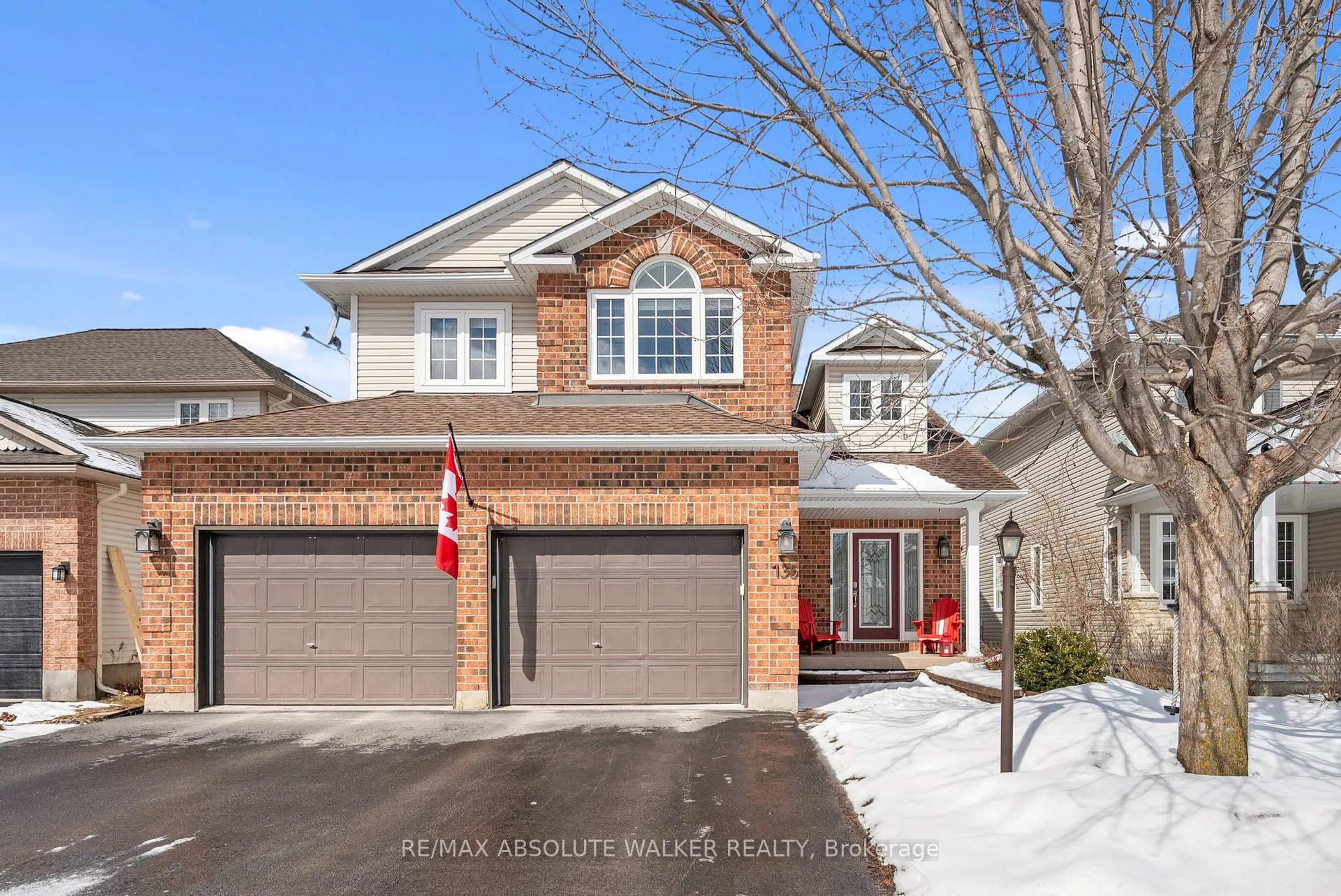 Home with brick exterior material, street for 135 Arrowwood Dr, Stittsville Ontario K2S 2G3