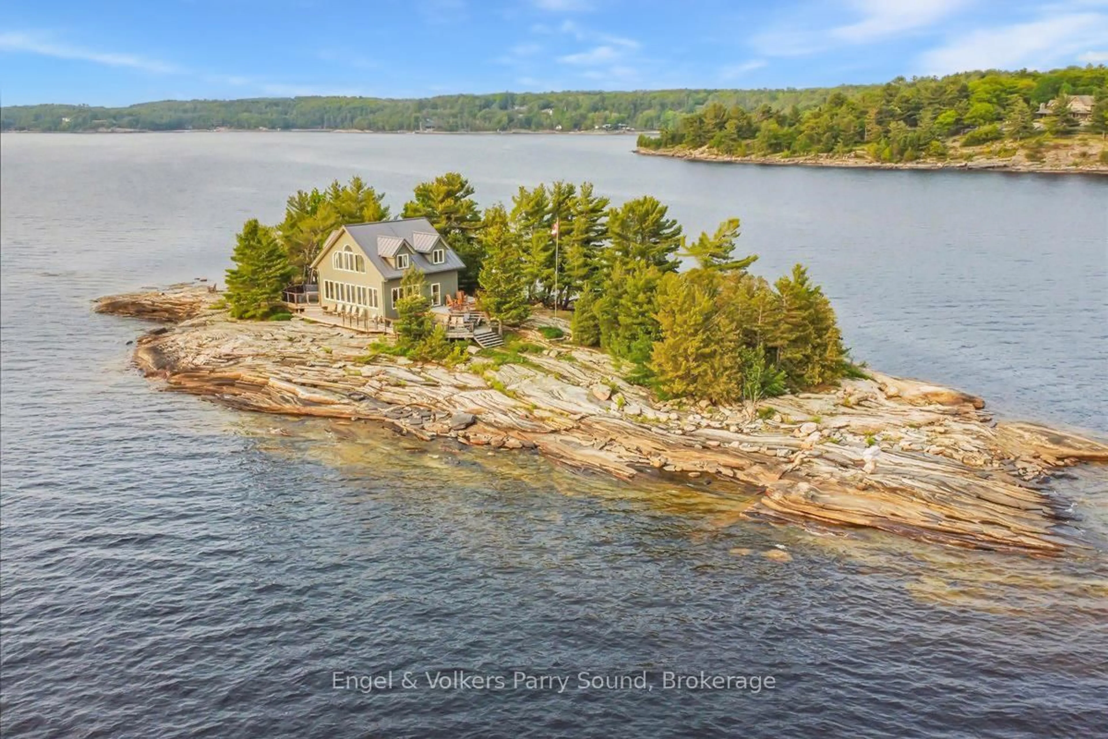 A pic from outside/outdoor area/front of a property/back of a property/a pic from drone, water/lake/river/ocean view for 1 Three Tree Island, McDougall Ontario P0G 1G0