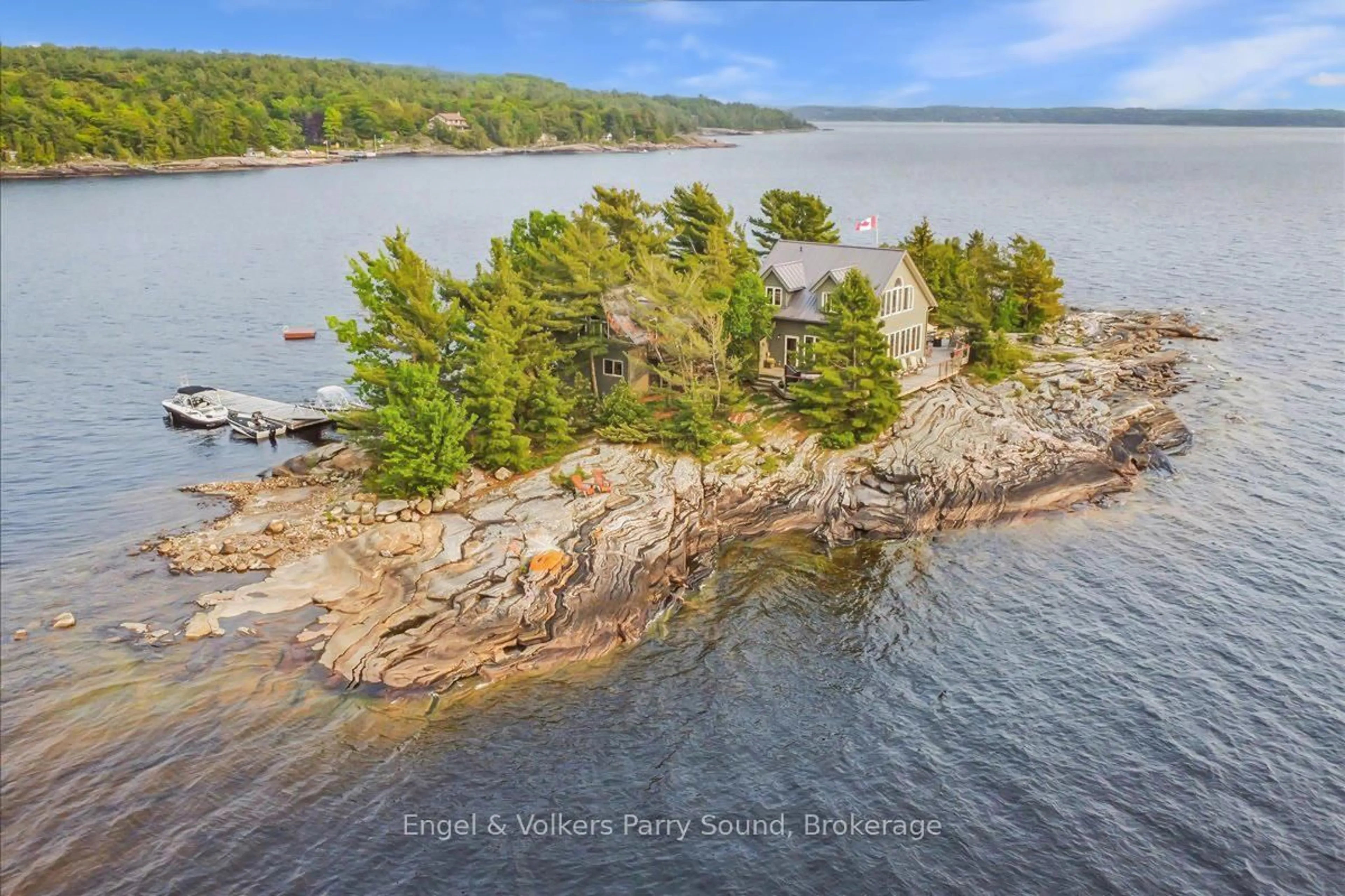 A pic from outside/outdoor area/front of a property/back of a property/a pic from drone, water/lake/river/ocean view for 1 Three Tree Island, McDougall Ontario P0G 1G0