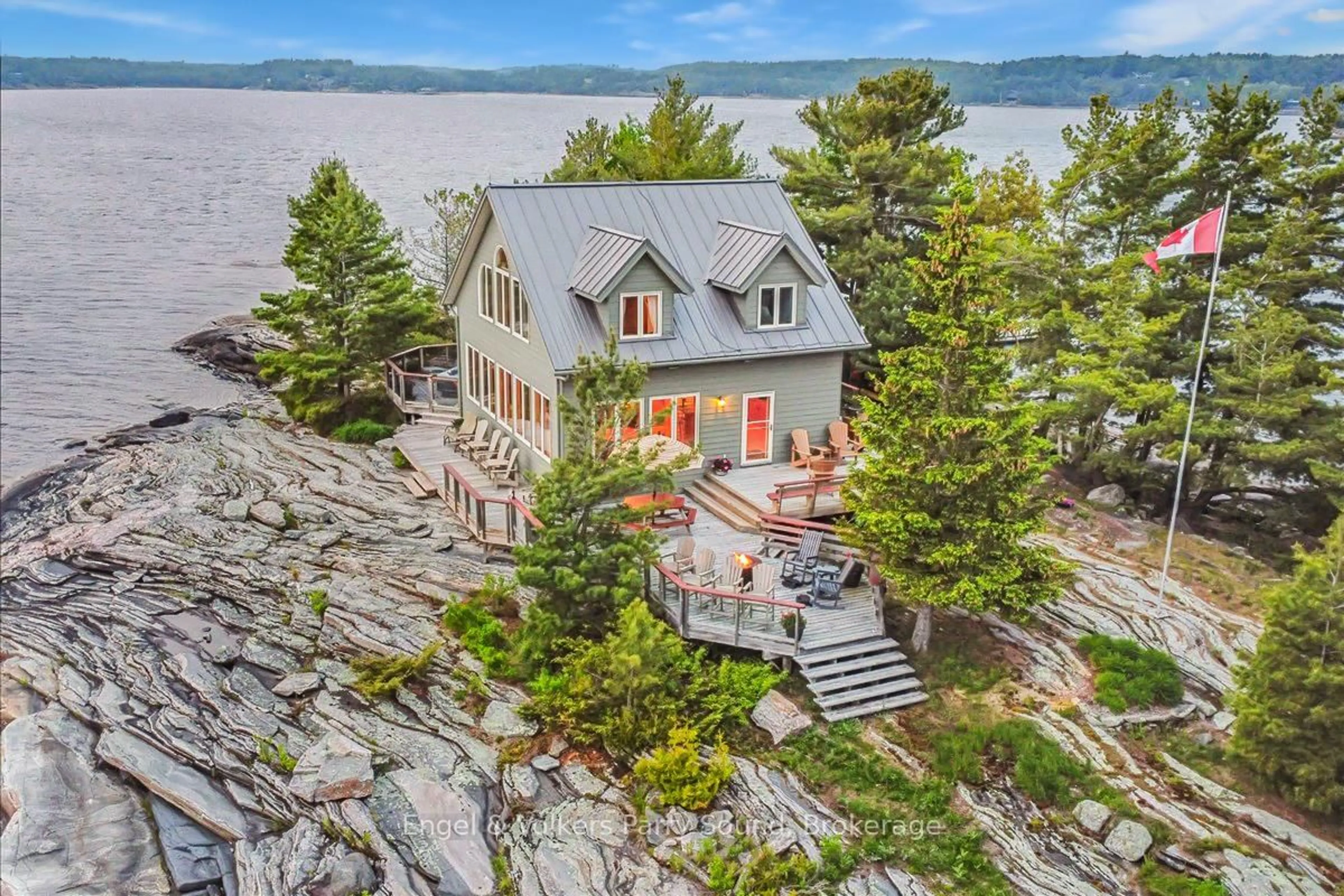 A pic from outside/outdoor area/front of a property/back of a property/a pic from drone, water/lake/river/ocean view for 1 Three Tree Island, McDougall Ontario P0G 1G0