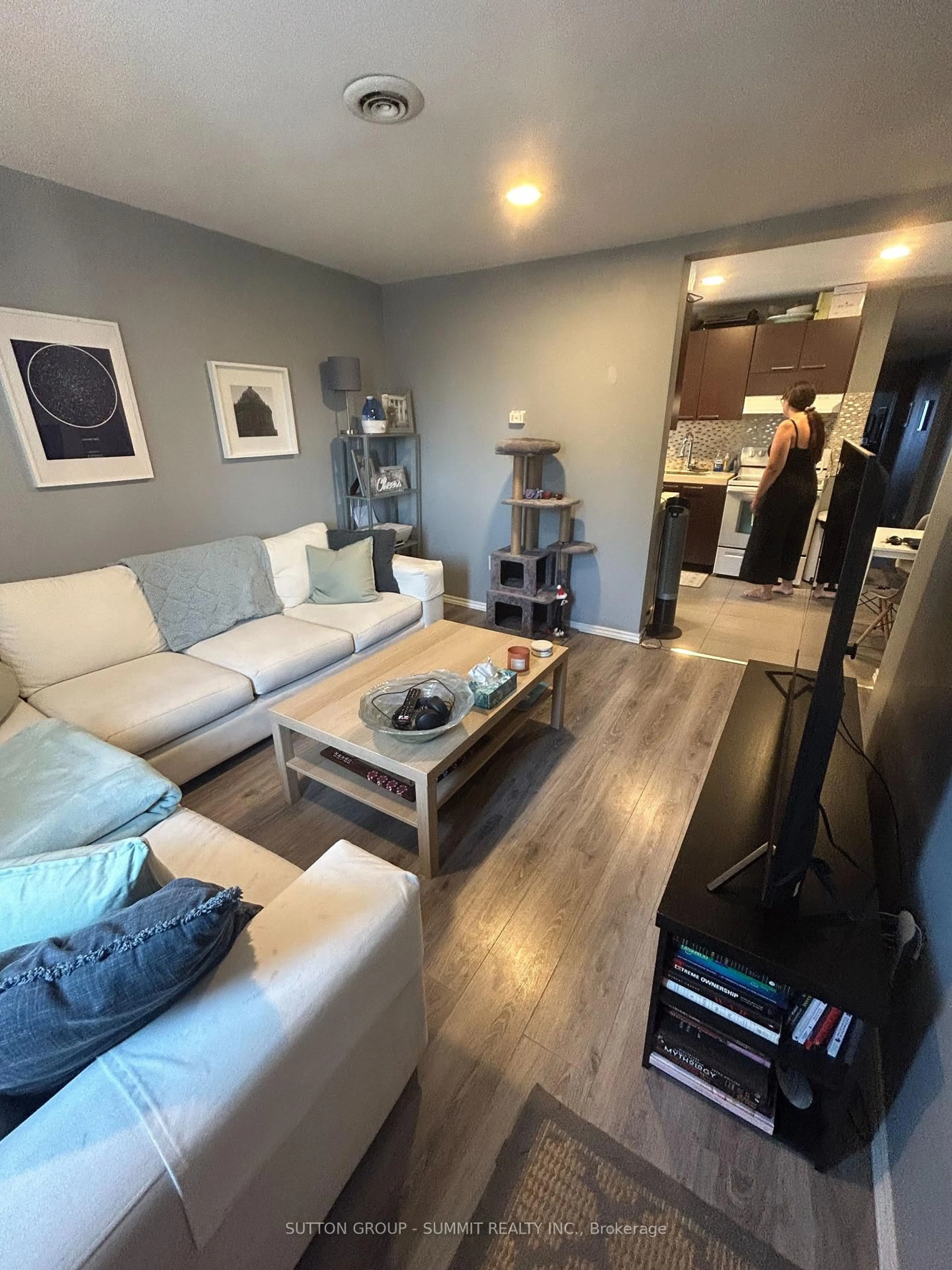 Living room with furniture, wood/laminate floor for 8 St Matthews Ave, Hamilton Ontario L8L 5P3