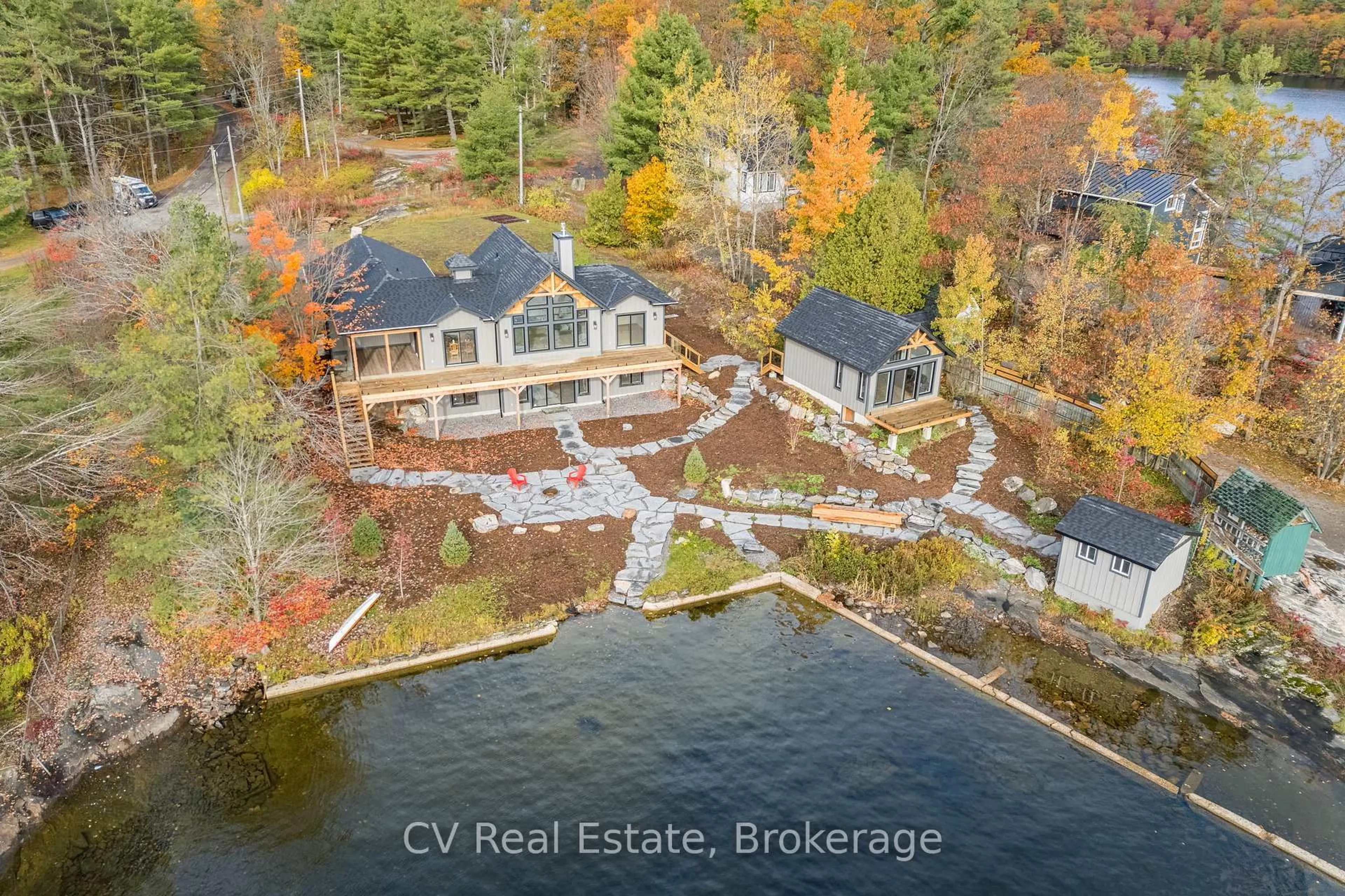 A pic from outside/outdoor area/front of a property/back of a property/a pic from drone, water/lake/river/ocean view for 1111 Lakeshore Dr, Gravenhurst Ontario P1P 1R2
