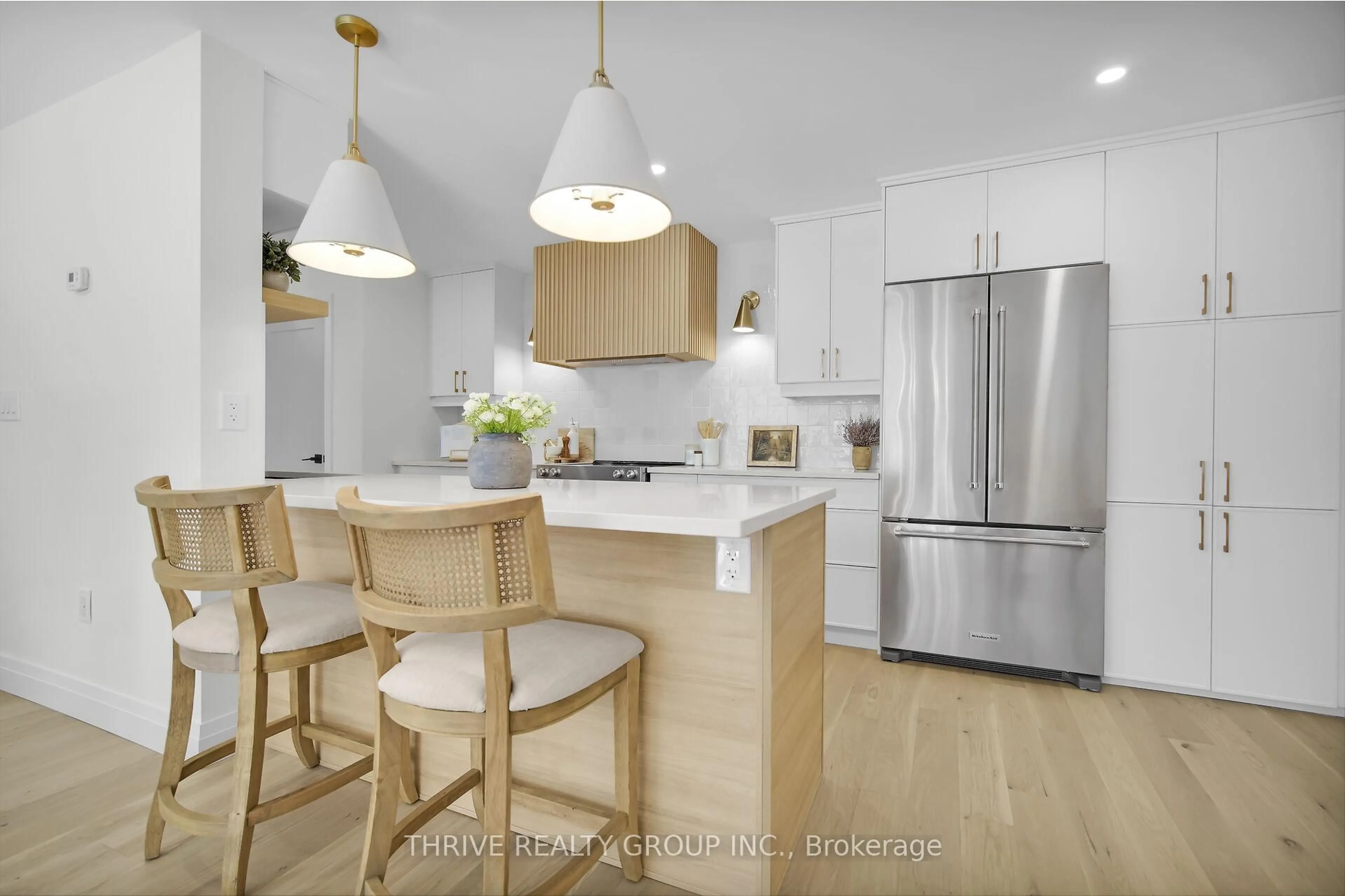 Open concept kitchen, wood/laminate floor for 1180 Commissioners Rd #105, London South Ontario N6K 4J2