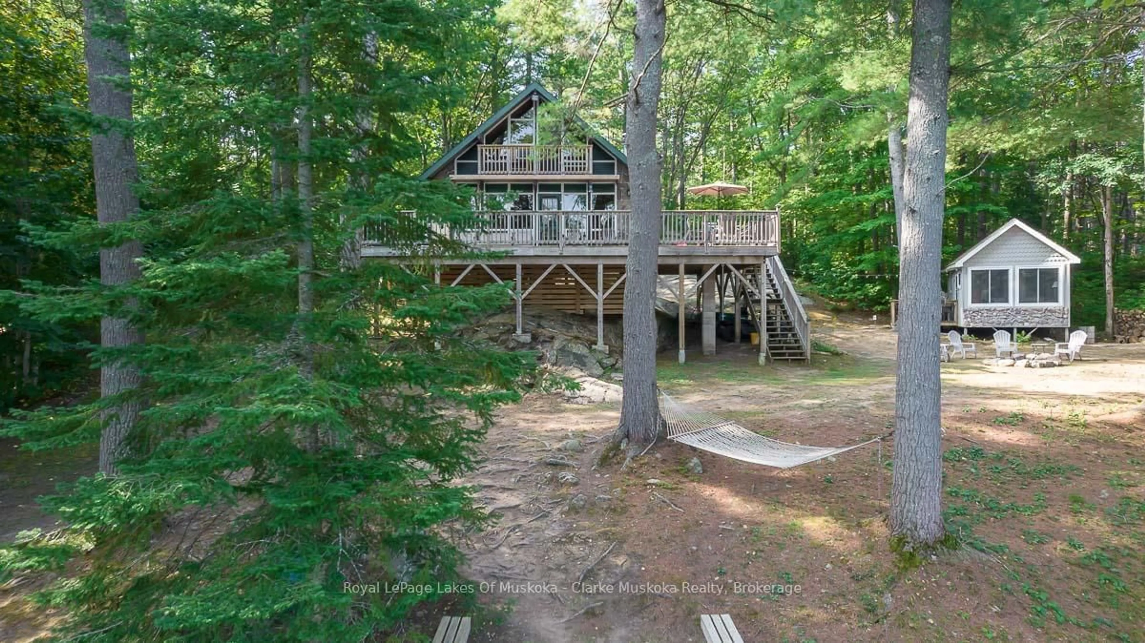 A pic from outside/outdoor area/front of a property/back of a property/a pic from drone, forest/trees view for 4 Severn River Shore, Georgian Bay Ontario P0C 1M0