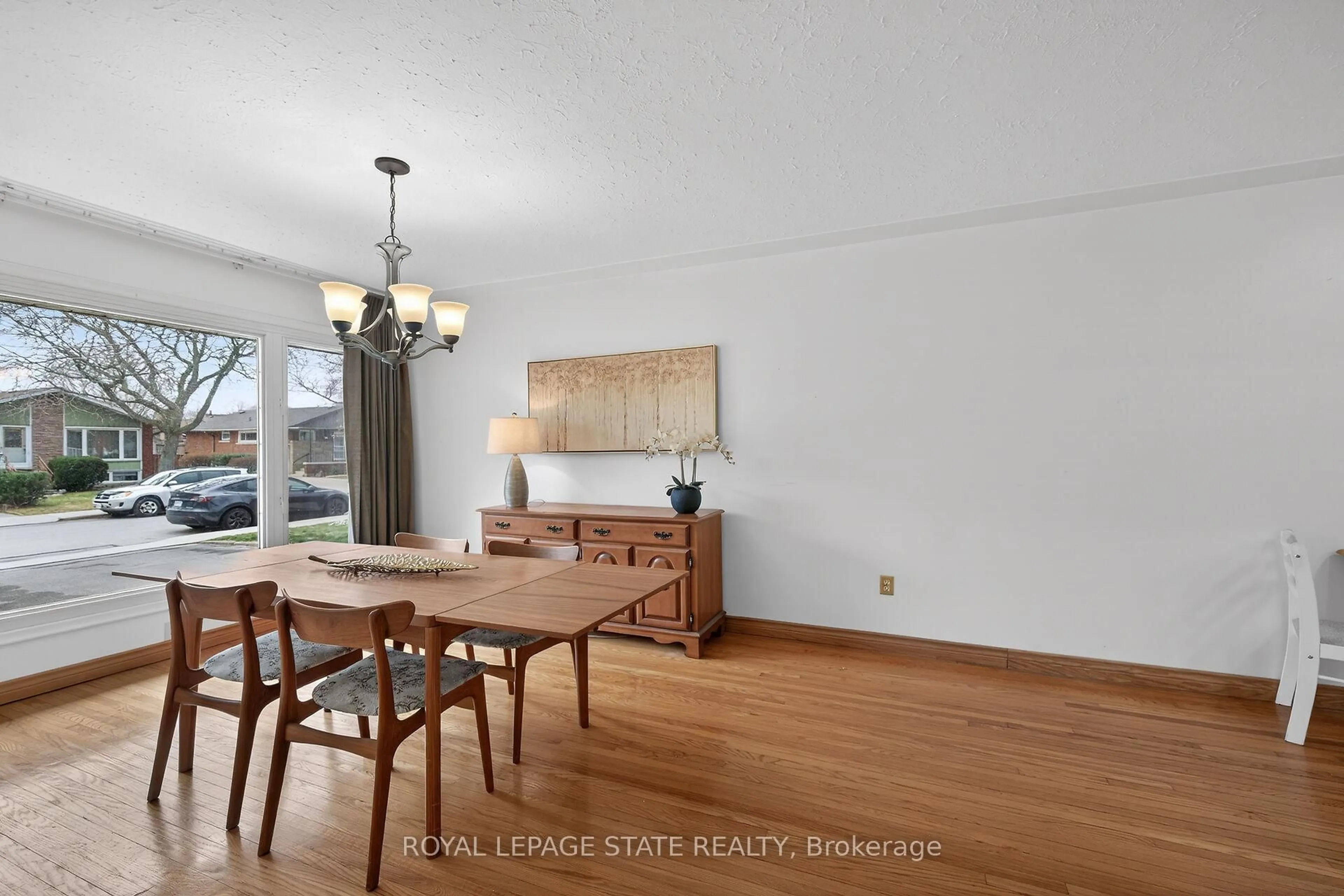 Dining room, wood/laminate floor for 19 Burfield Ave, Hamilton Ontario L8T 2J8