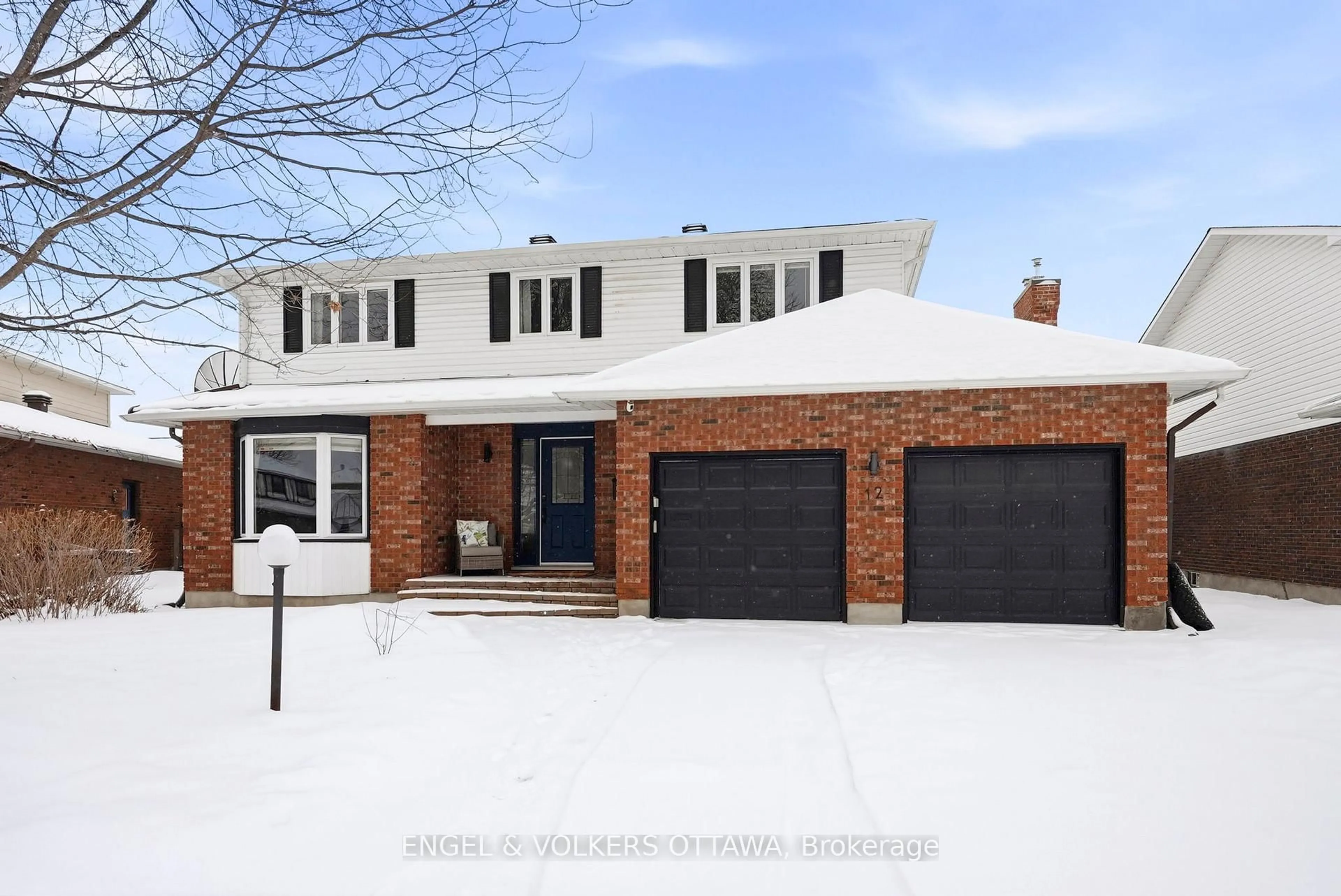 Home with brick exterior material, street for 12 Mancil Dr, Ottawa Ontario K2J 2J5