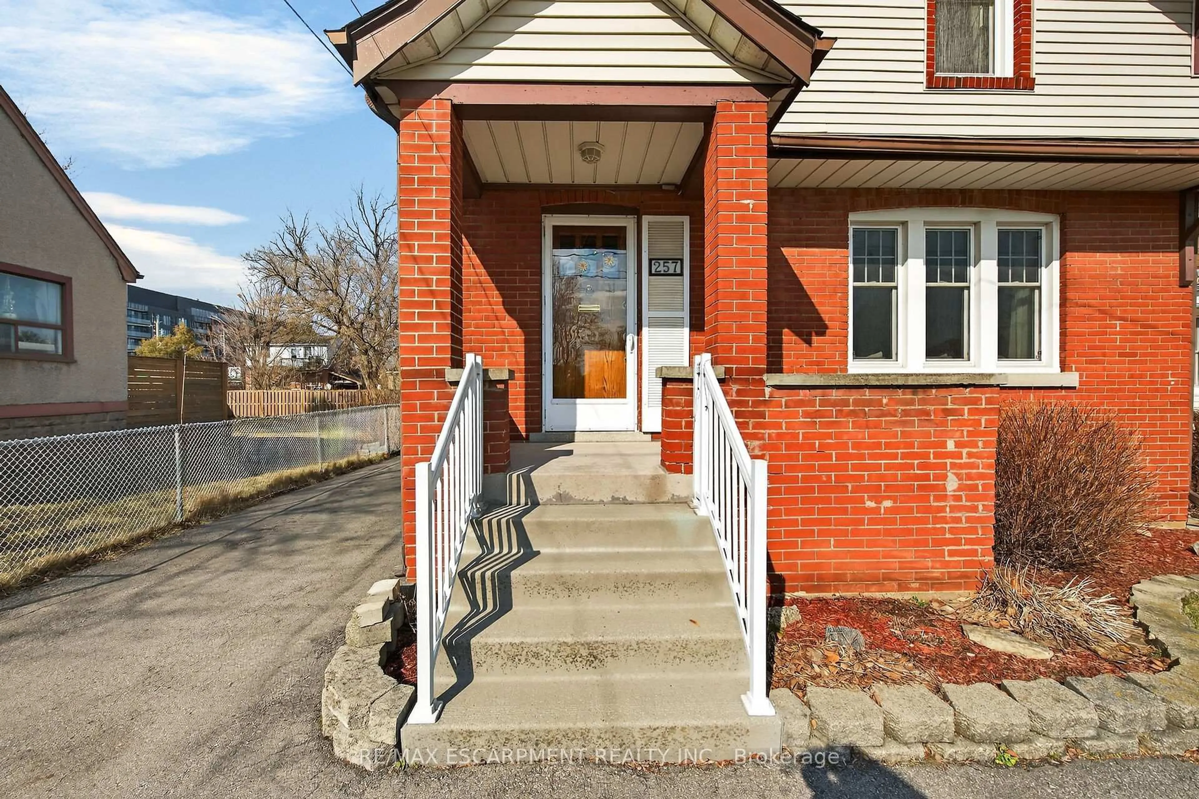 Home with brick exterior material, street for 257 Queensdale Ave, Hamilton Ontario L9A 1L3