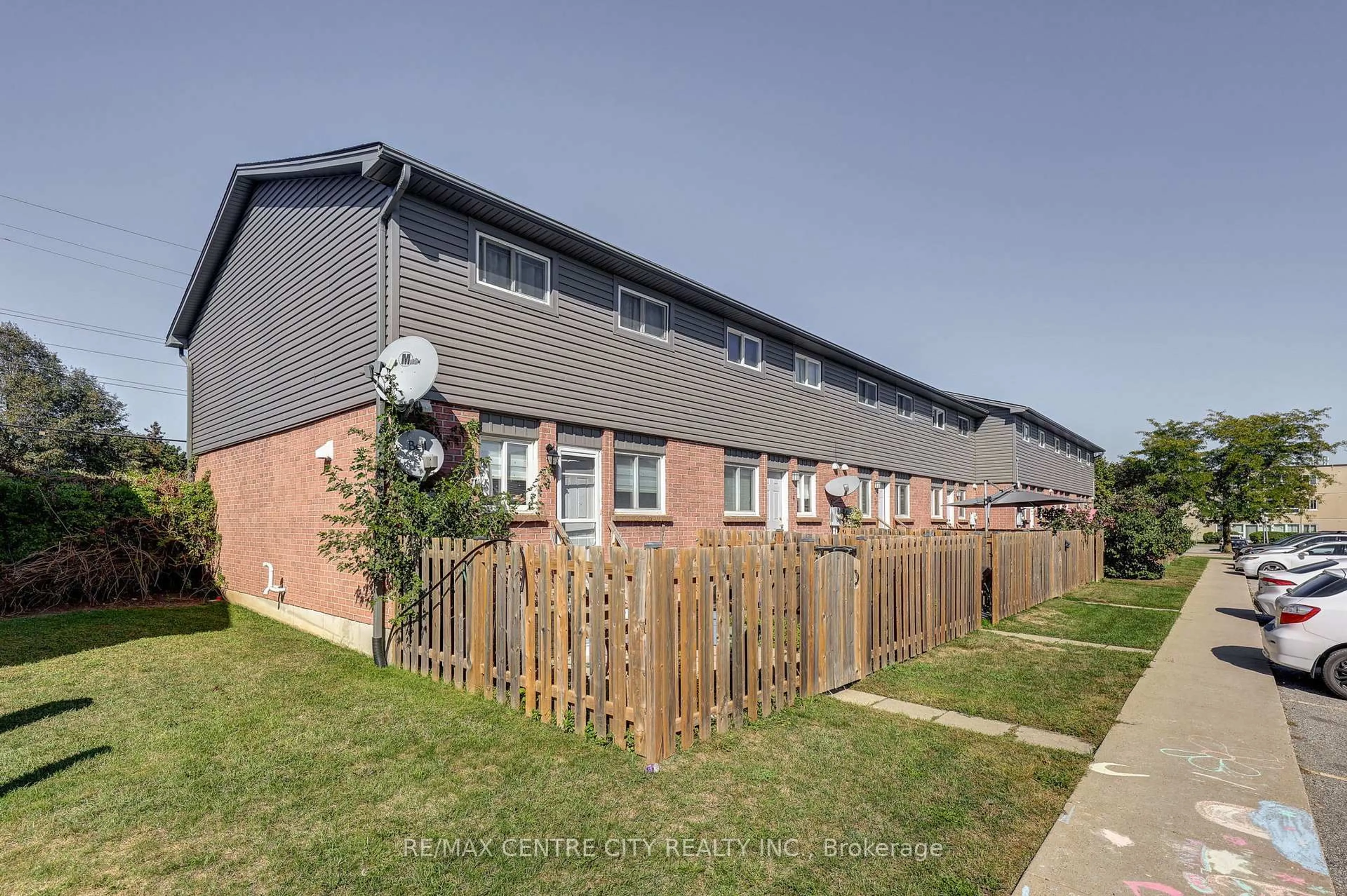 A pic from outside/outdoor area/front of a property/back of a property/a pic from drone, street for 1443 Huron St #5, London East Ontario N5V 2E6