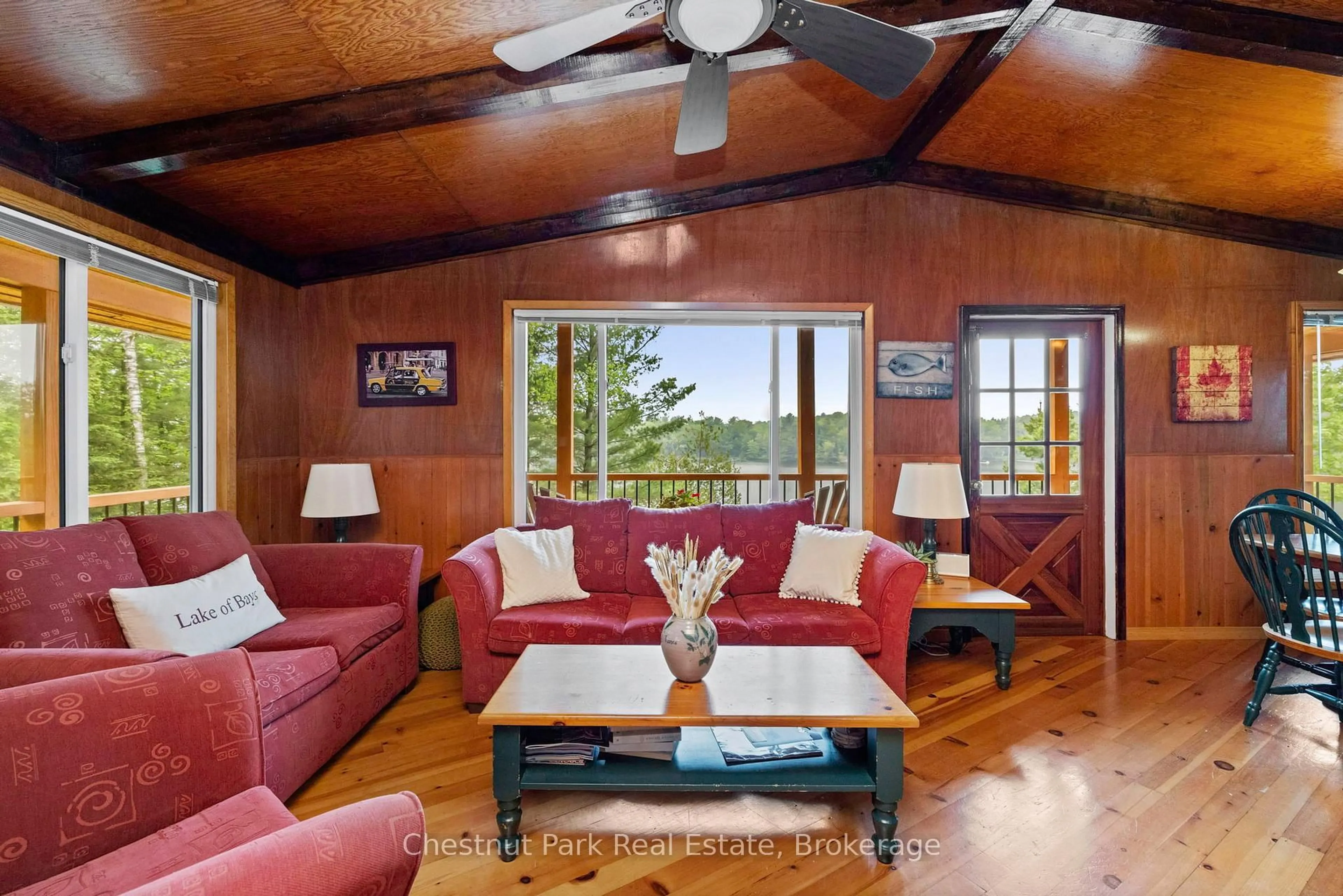 Living room with furniture, wood/laminate floor for 4 Mallard Lane, Lake of Bays Ontario P0B 1A0