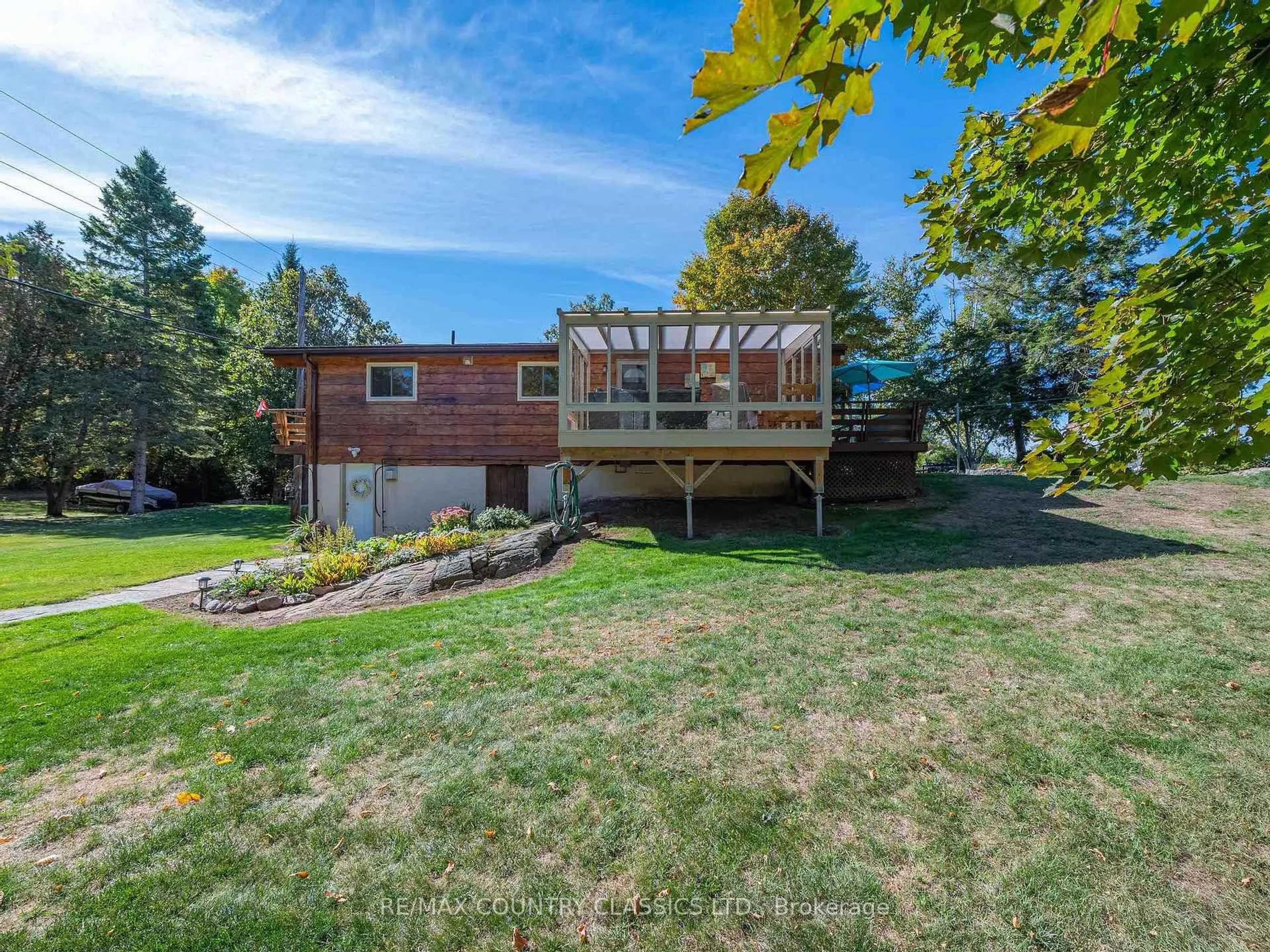 A pic from outside/outdoor area/front of a property/back of a property/a pic from drone, water/lake/river/ocean view for 27 Martin Lane, North Kawartha Ontario K0L 1A0