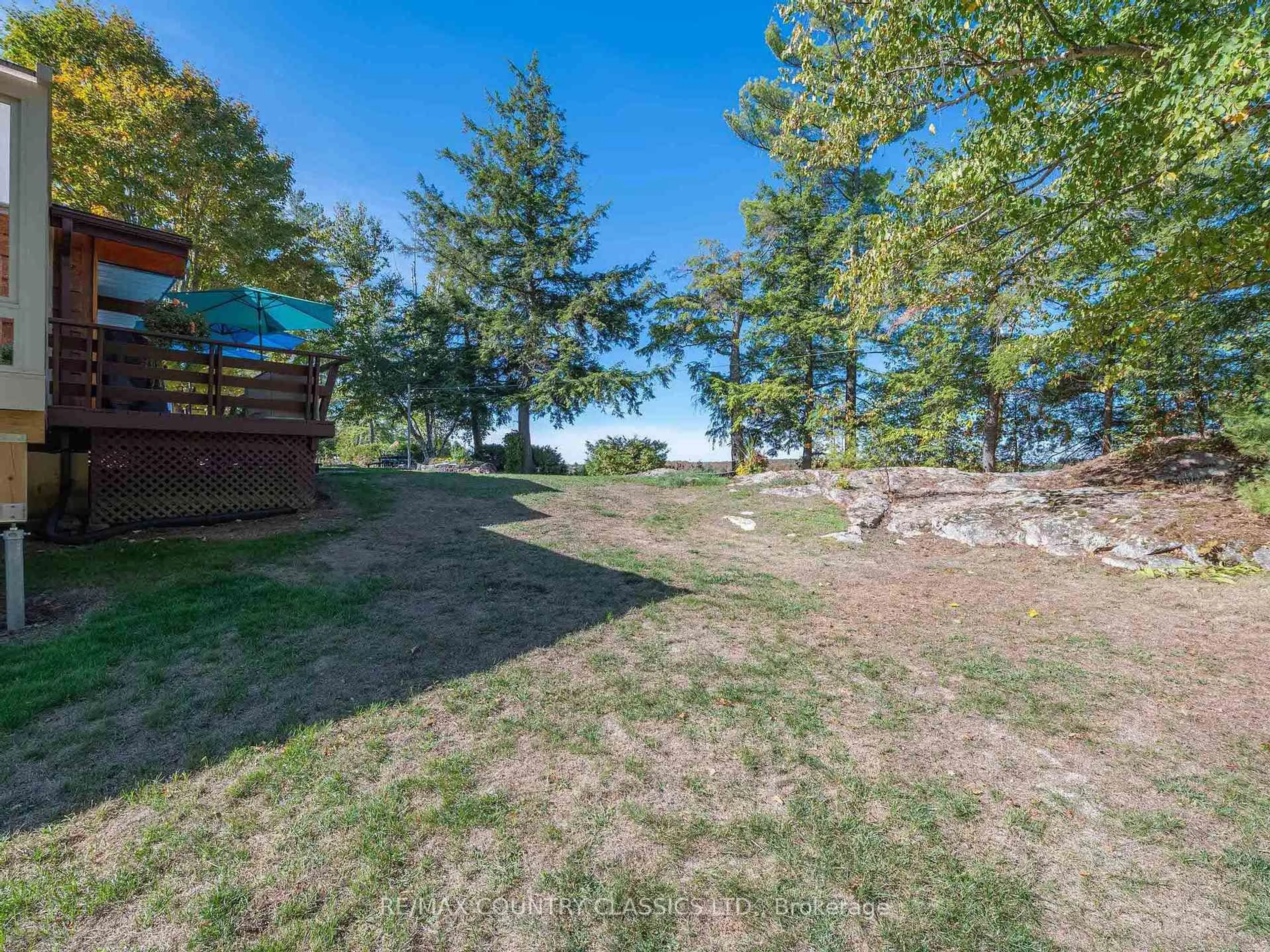 A pic from outside/outdoor area/front of a property/back of a property/a pic from drone, water/lake/river/ocean view for 27 Martin Lane, North Kawartha Ontario K0L 1A0