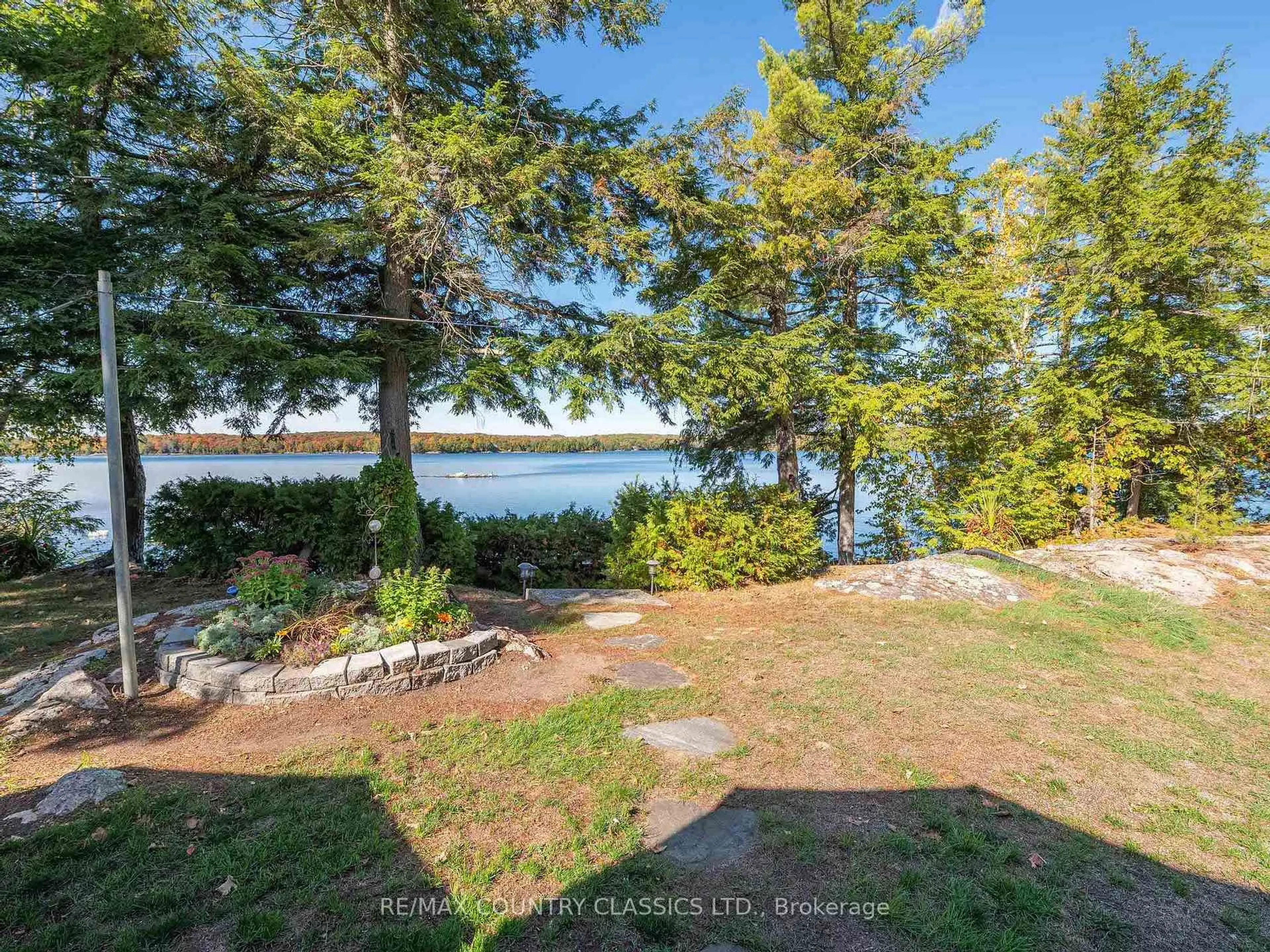 A pic from outside/outdoor area/front of a property/back of a property/a pic from drone, water/lake/river/ocean view for 27 Martin Lane, North Kawartha Ontario K0L 1A0