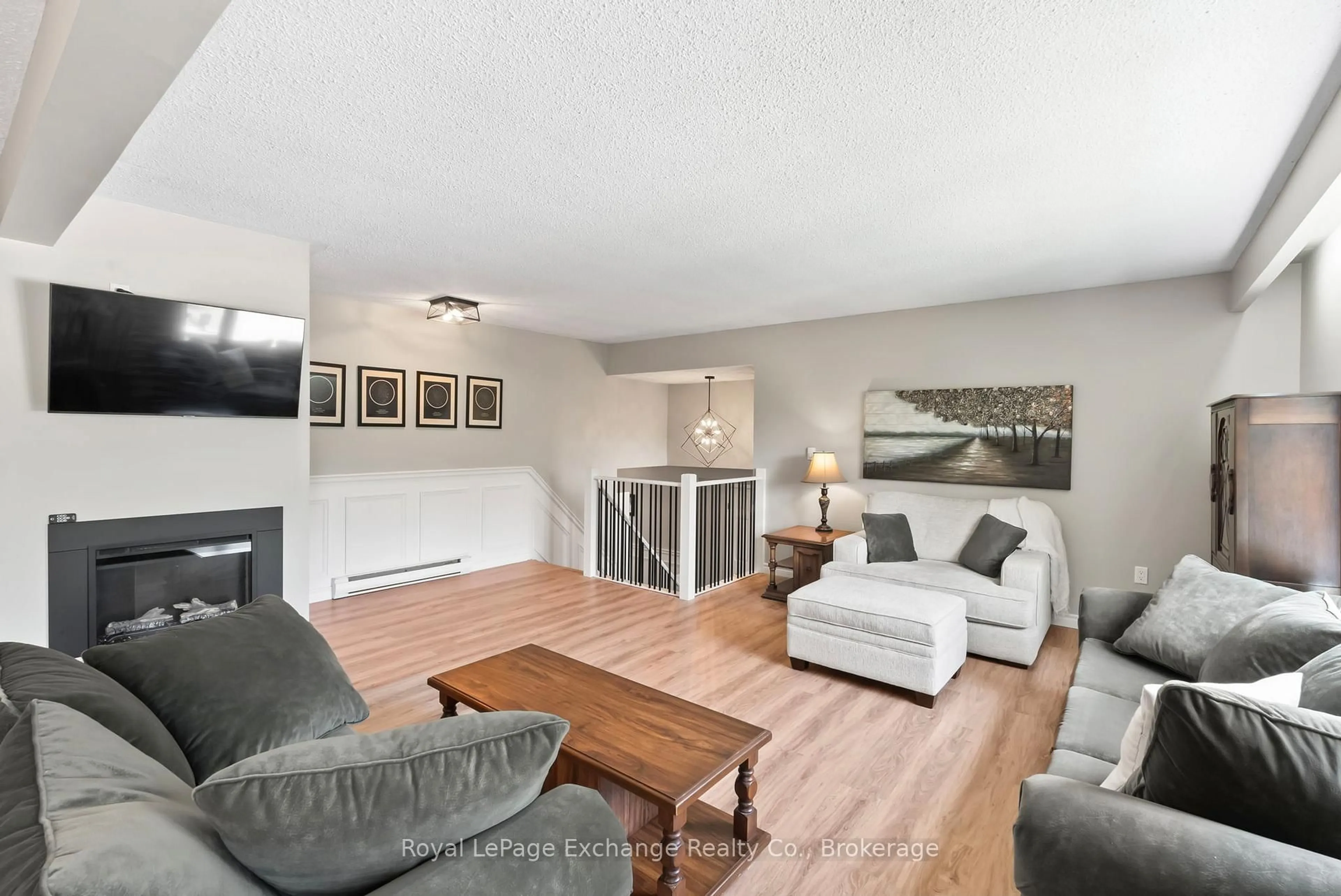 Living room with furniture, wood/laminate floor for 71 Upper Lorne Beach Rd, Kincardine Ontario N0G 2T0
