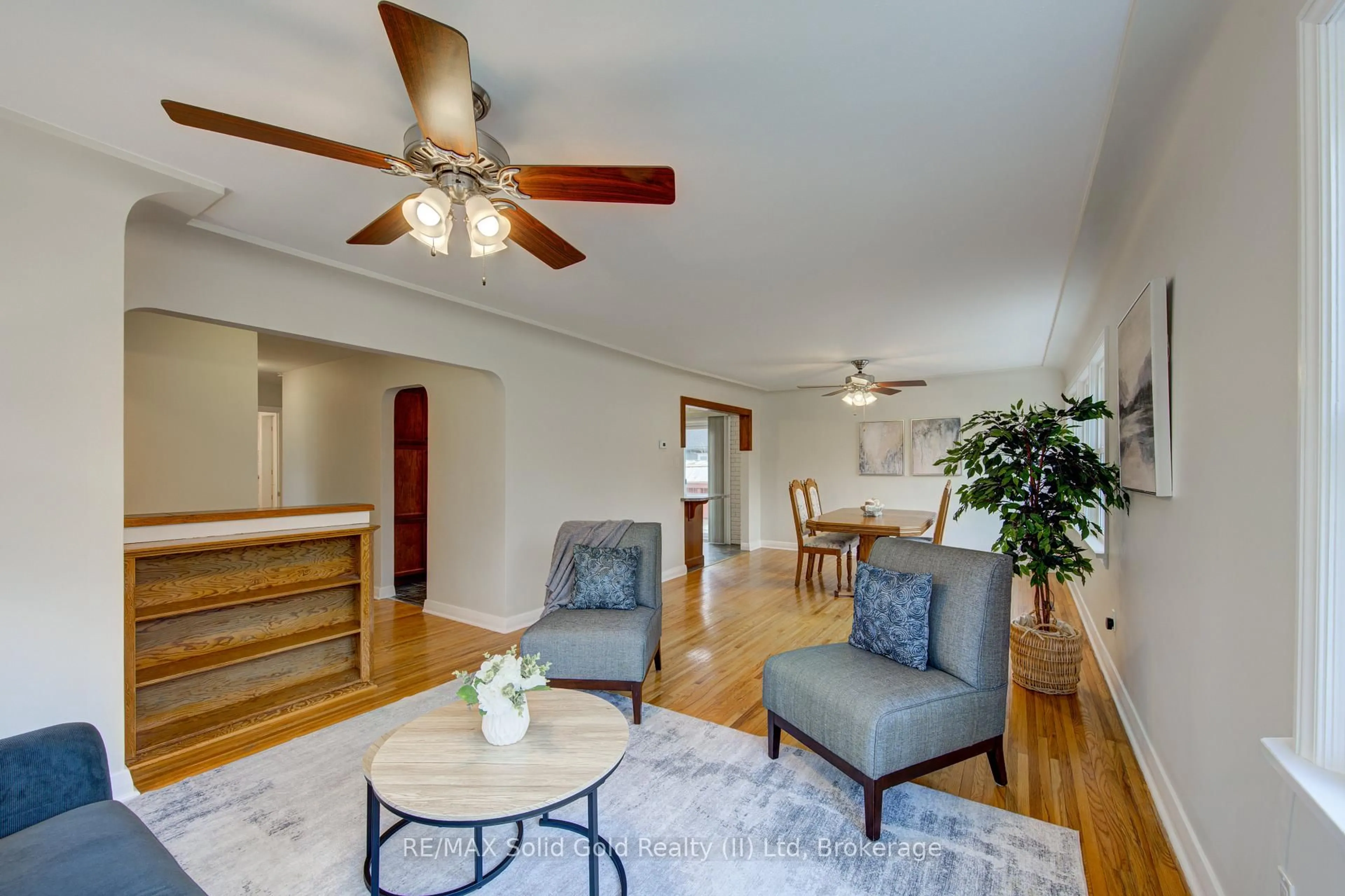 Living room with furniture, wood/laminate floor for 133 Glastonbury Cres, Stratford Ontario N5A 6J1