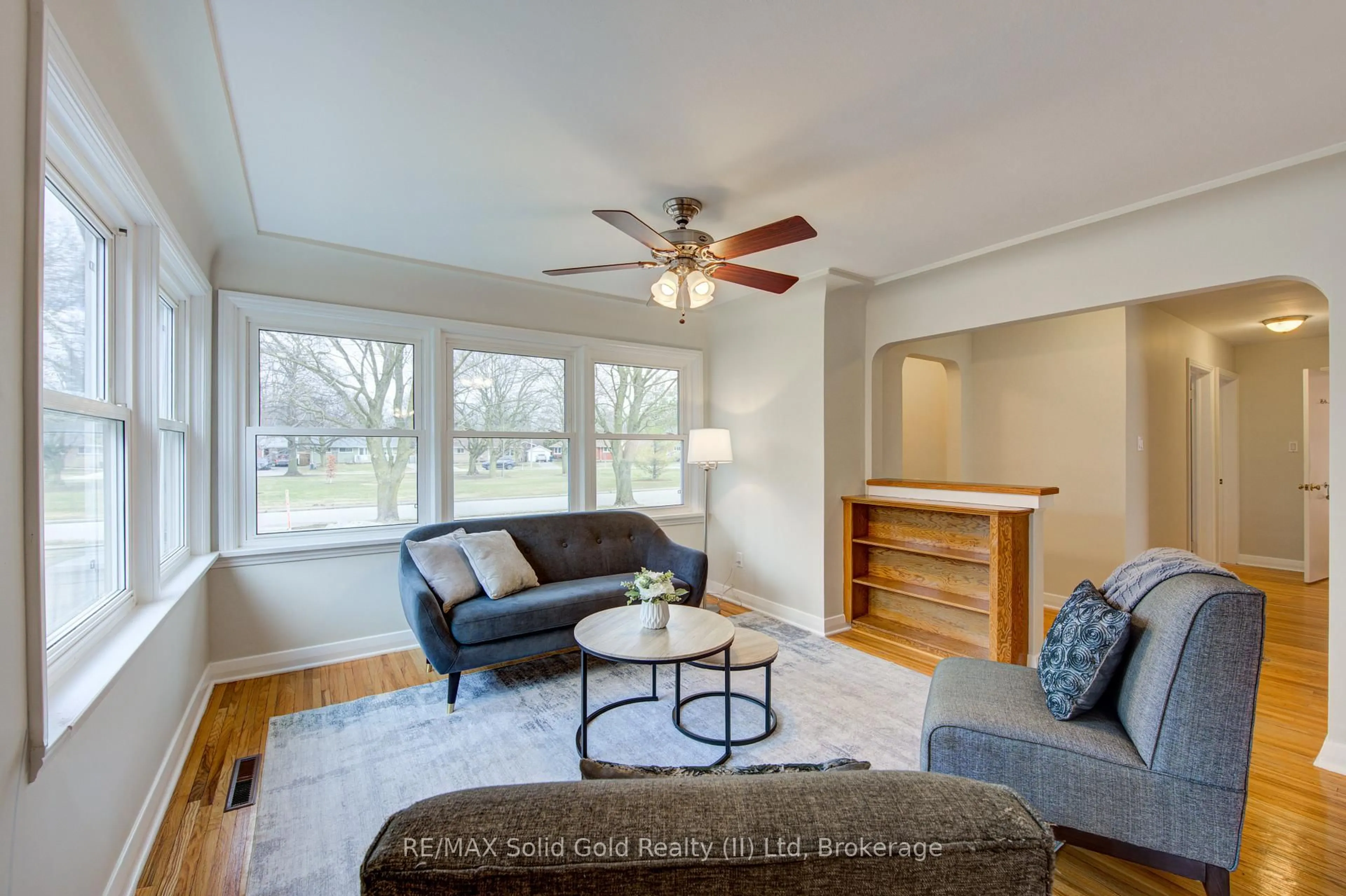 Living room with furniture, wood/laminate floor for 133 Glastonbury Cres, Stratford Ontario N5A 6J1