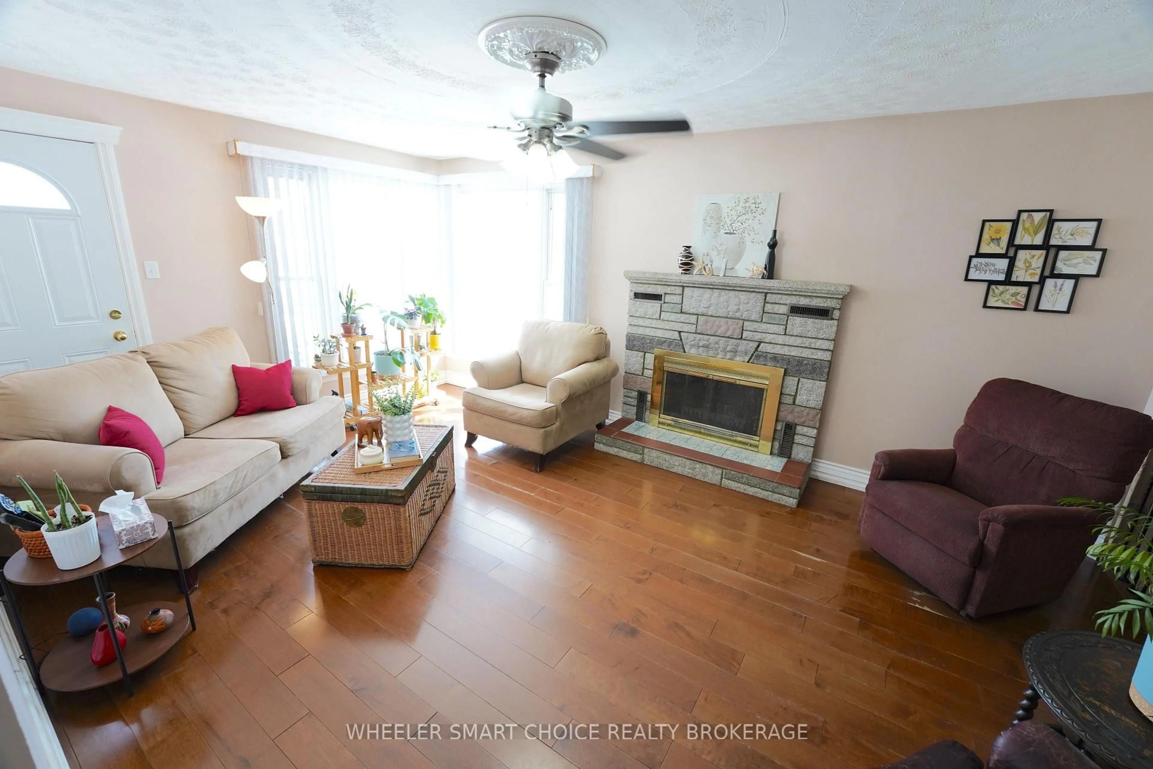 Living room with furniture, wood/laminate floor for 300 Gardener Ave, Cornwall Ontario K6H 5H8