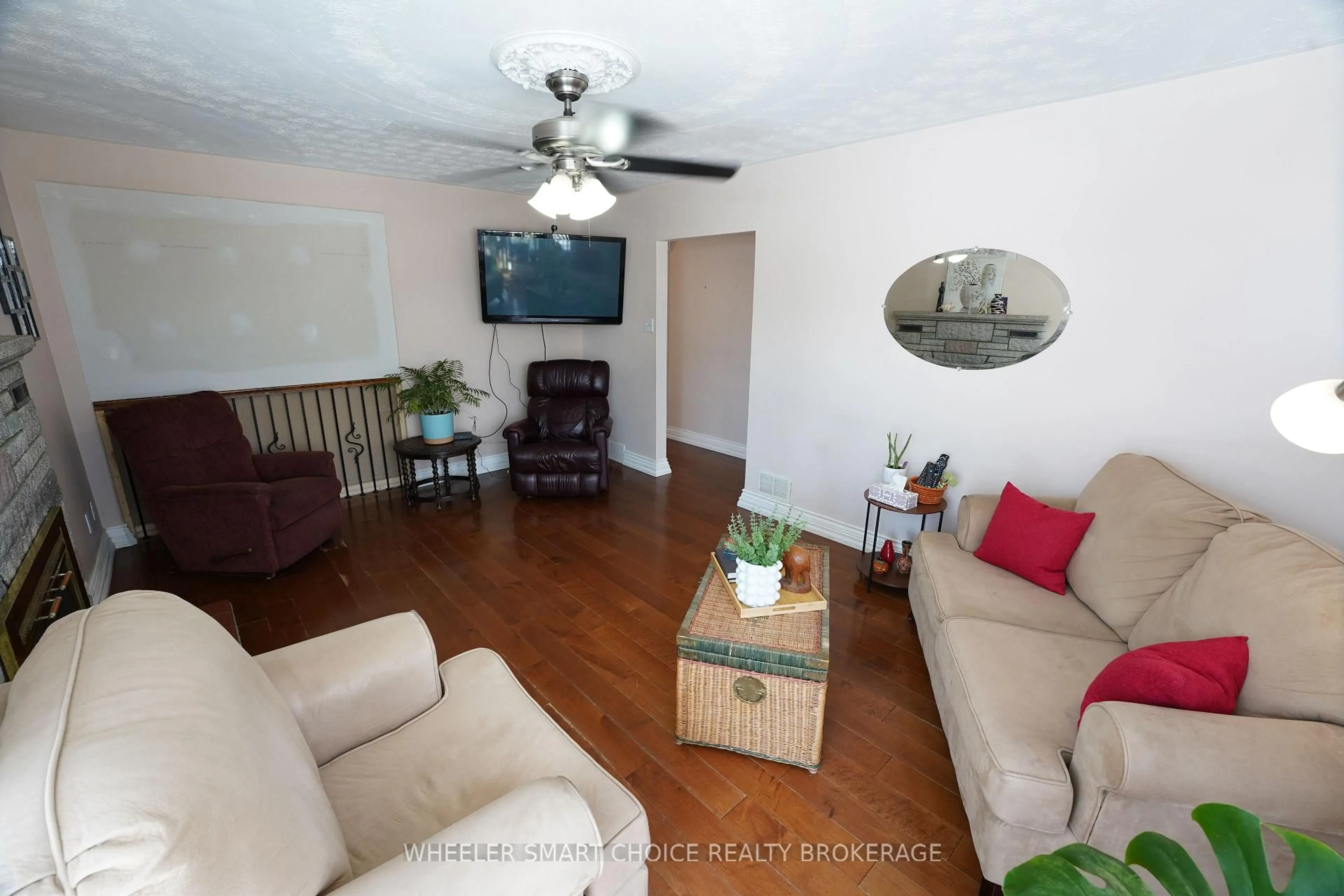 Living room with furniture, wood/laminate floor for 300 Gardener Ave, Cornwall Ontario K6H 5H8