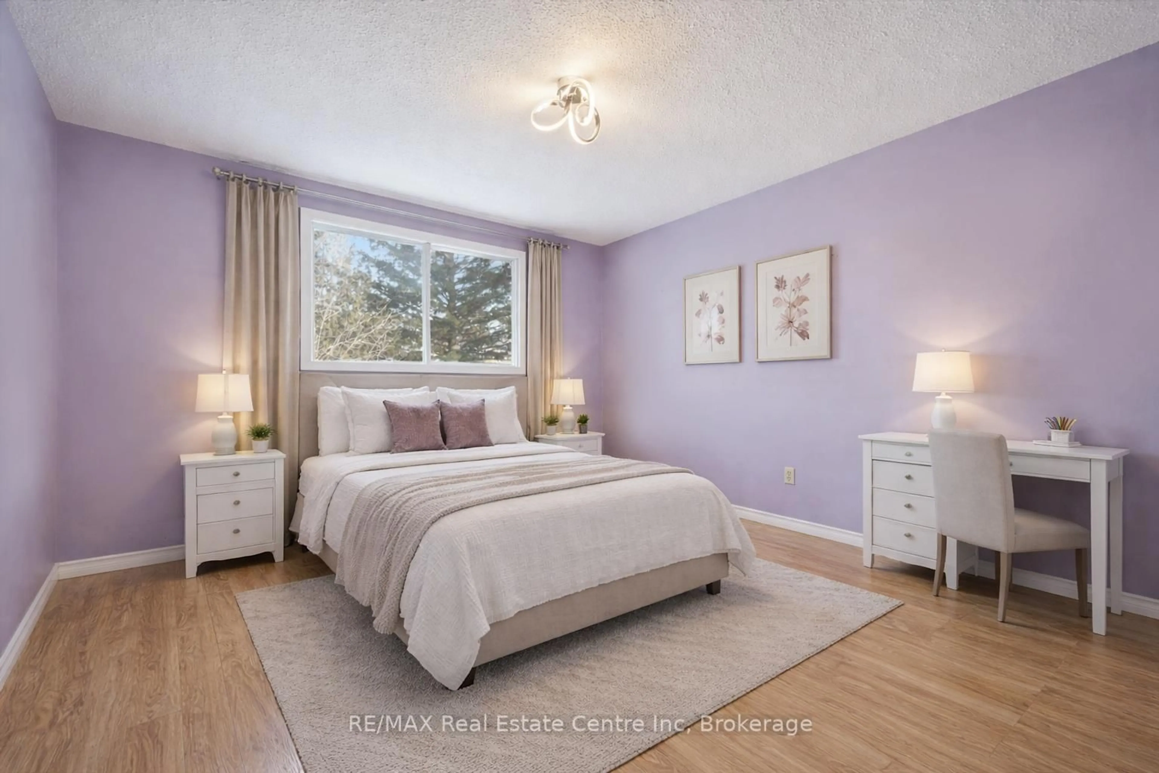 Bedroom with bed, wood/laminate floor for 105 Churchill St, Waterloo Ontario N2L 2X1