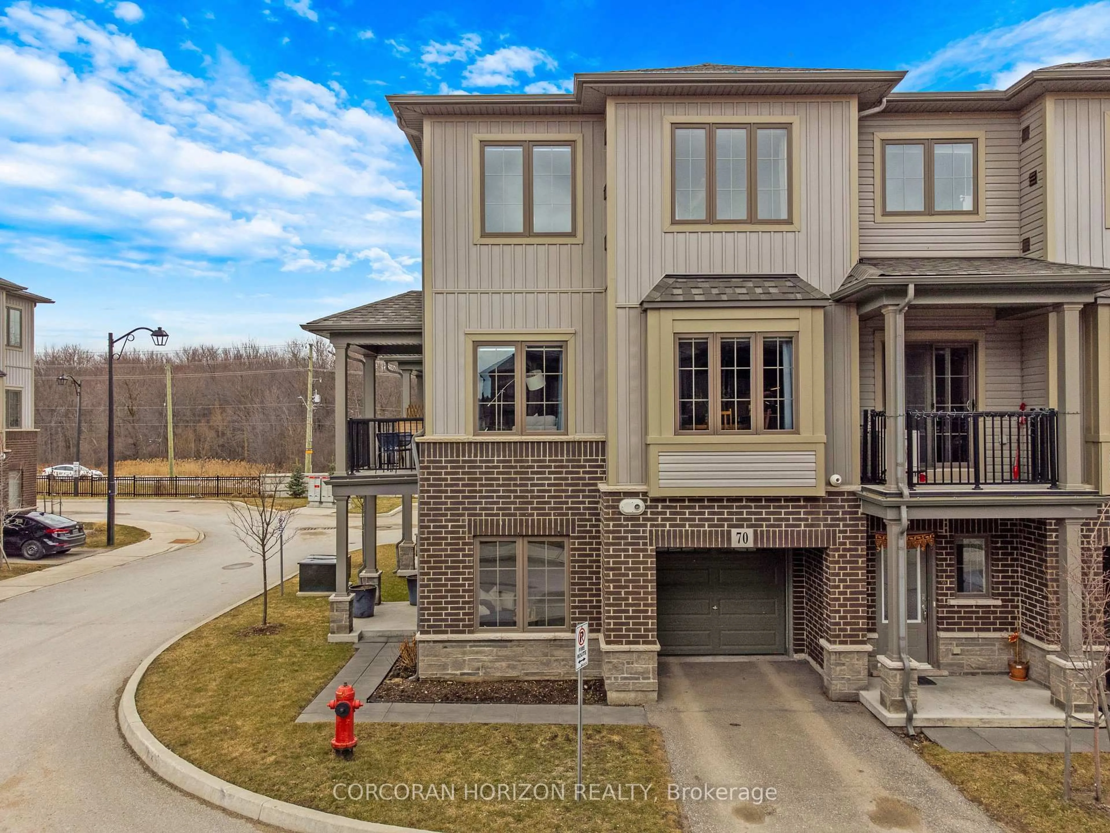 A pic from outside/outdoor area/front of a property/back of a property/a pic from drone, street for 124 Compass Tr #70, Cambridge Ontario N3E 0E3