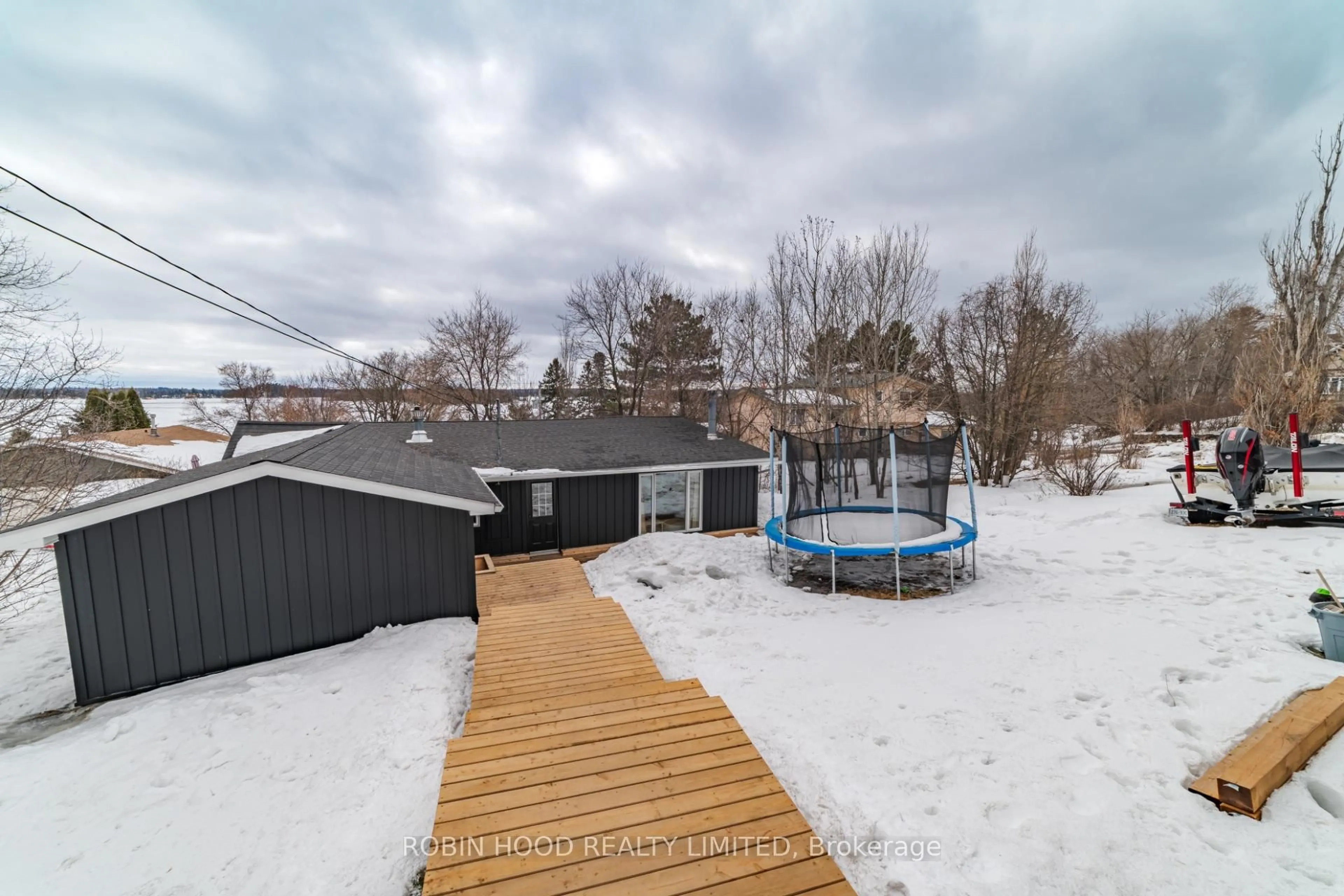 A pic from outside/outdoor area/front of a property/back of a property/a pic from drone, water/lake/river/ocean view for 715 Clair St, Kenora Ontario P0X 1C0